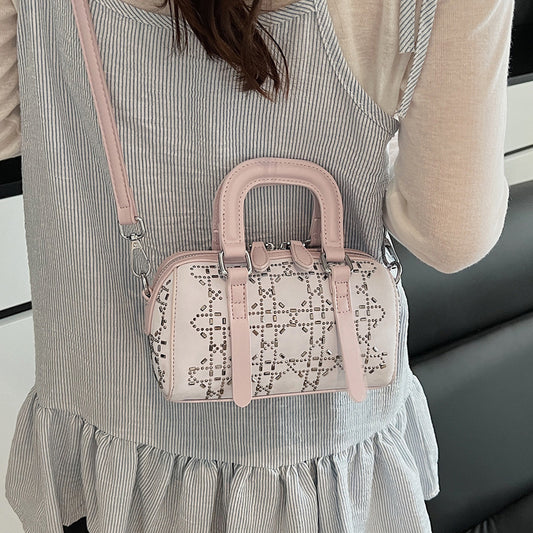 Black Korean-style minimalist cylindrical tote bag by Golden Heir with a pendant, versatile and chic for everyday use.