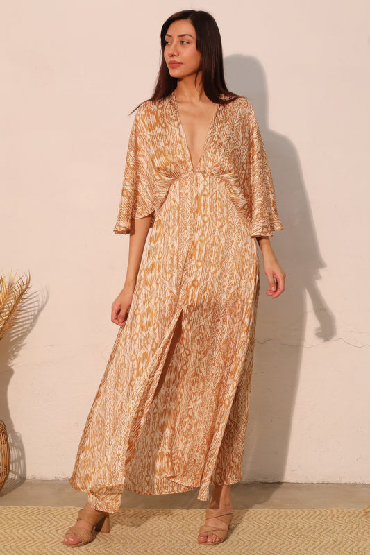 Golden Heir bohemian lurex chiffon cape maxi dress, flowing style with shimmering gold accents and lightweight fabric.