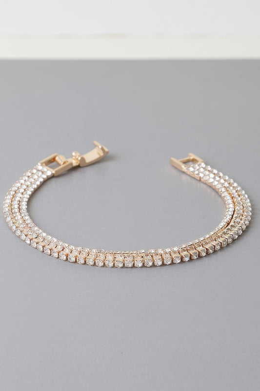 Golden Heir triple cubic jewel bracelet with silver and gold tones featuring sparkling cubic stones on a sleek bracelet.