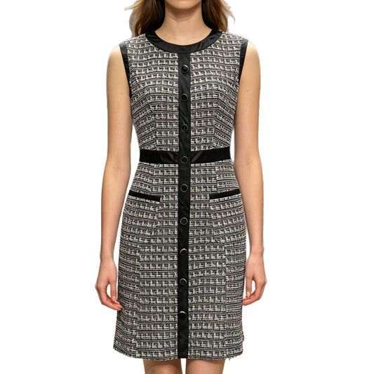 Vintage leather-trimmed tweed vest and A-line skirt dress by eprolo, featuring classic tailoring and textured fabric.