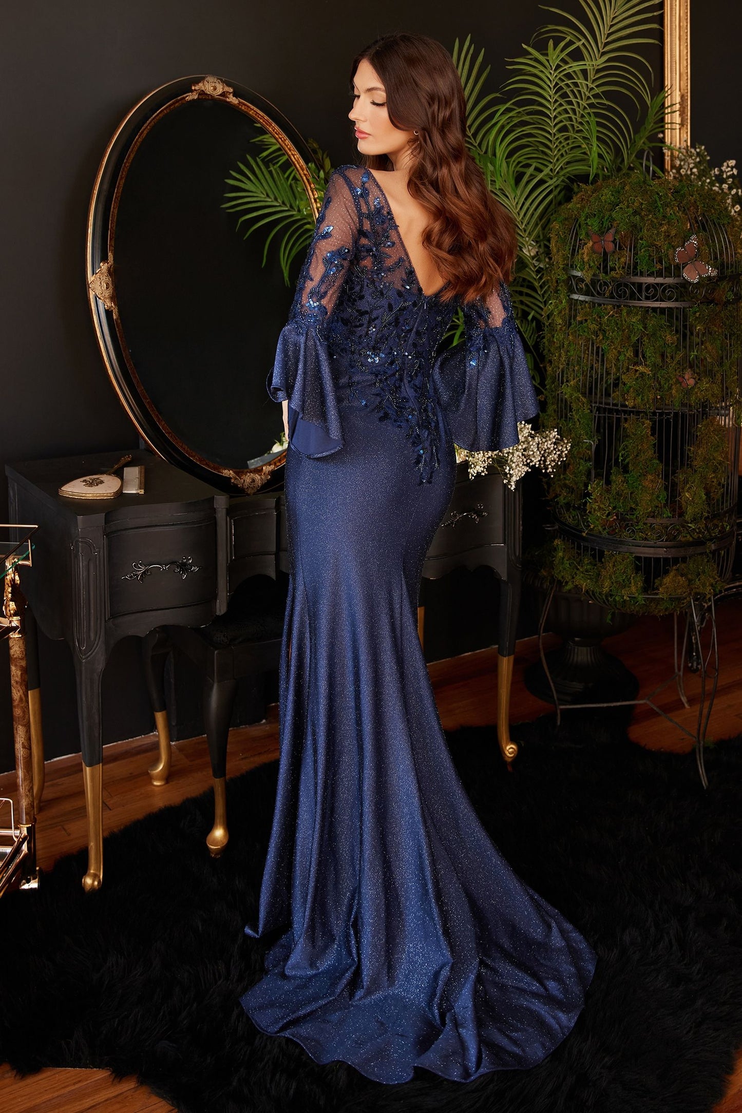 Navy long bell sleeve lace and satin gown by Tux-USA for formal events, featuring intricate lace detailing and elegant bell sleeves.