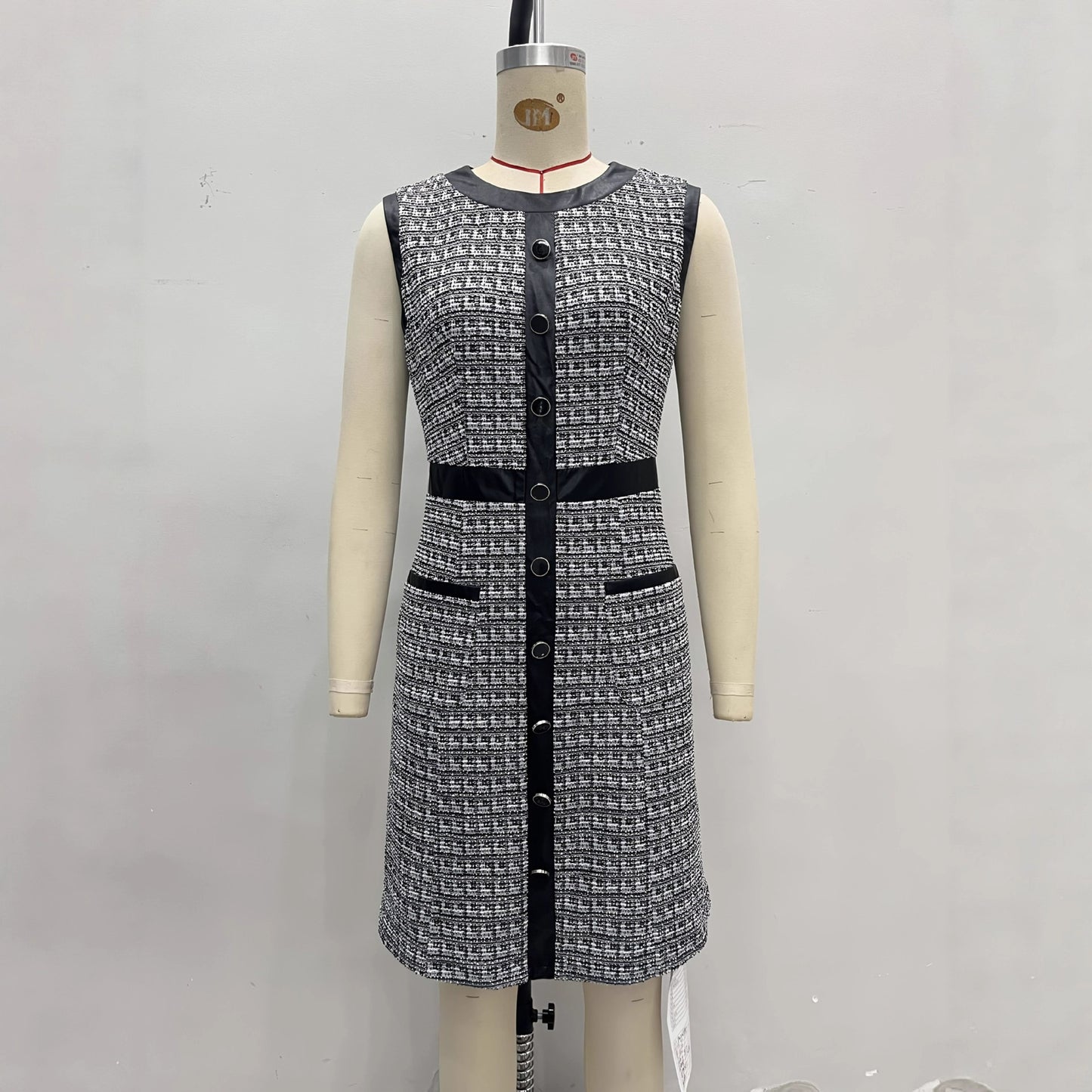 Vintage leather-trimmed tweed vest and A-line skirt dress by eprolo, featuring classic tweed fabric and tailored design.