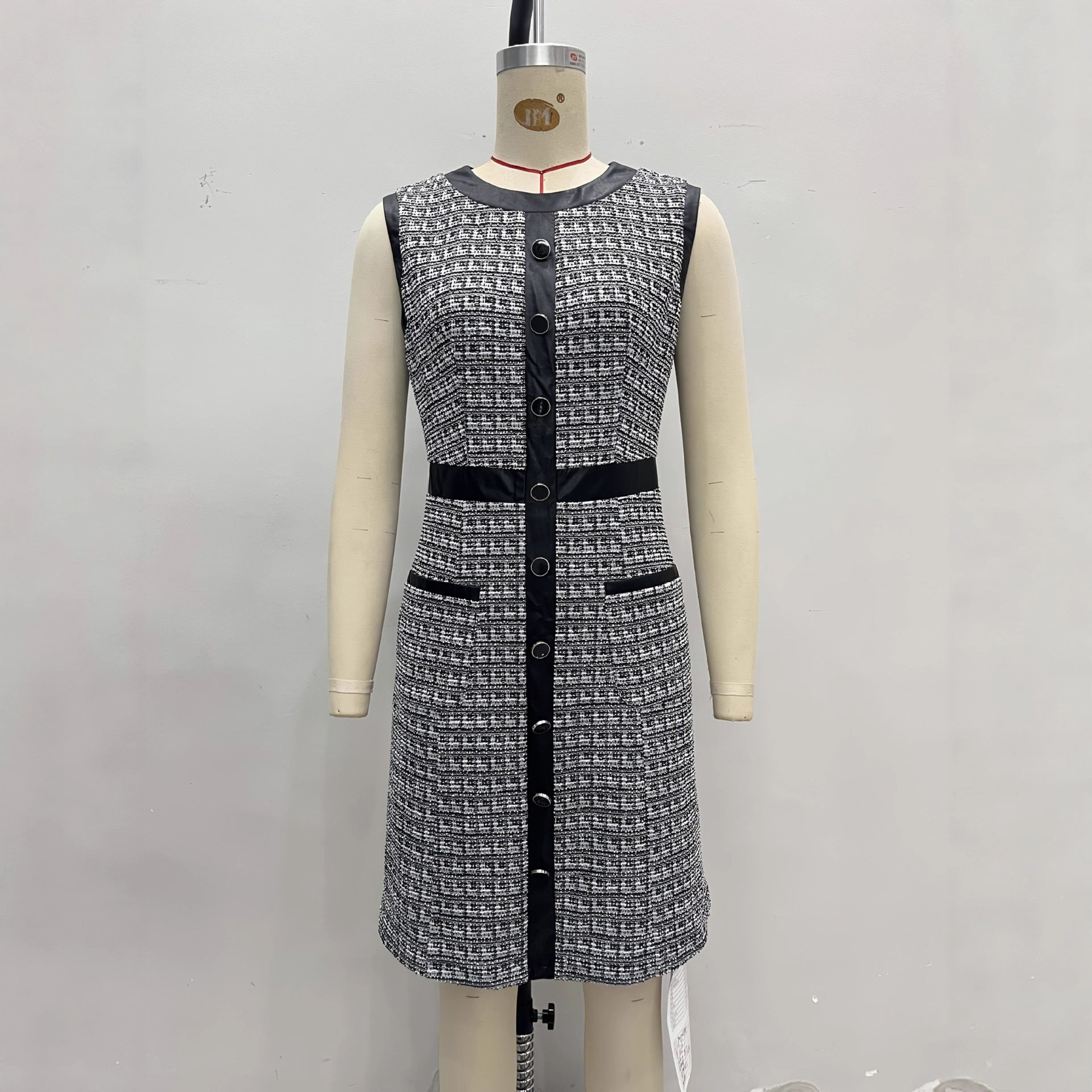 Vintage leather-trimmed tweed vest and A-line skirt dress by eprolo, featuring classic tweed fabric and tailored design.