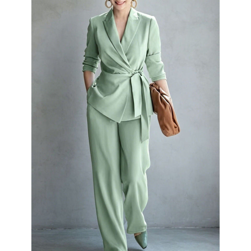 Elegant women's casual solid color suit set by eprolo featuring a belted top and matching pants, suitable for stylish everyday wear.