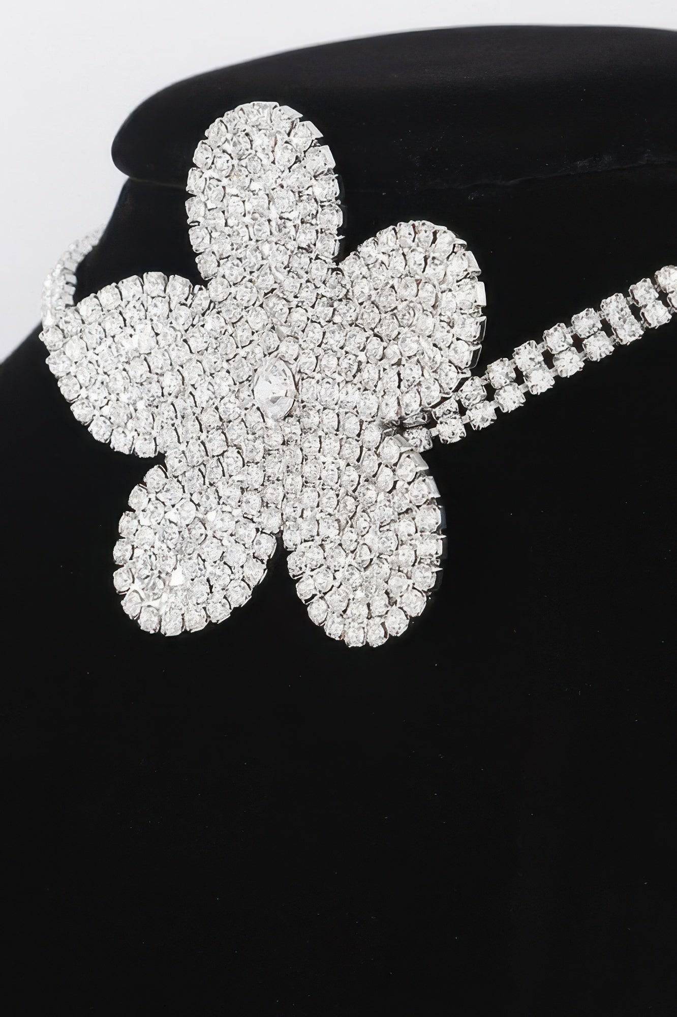 Golden Heir Flora Royale triple wrap pearl choker featuring elegant white pearls and gold accents, styled for a sophisticated look.