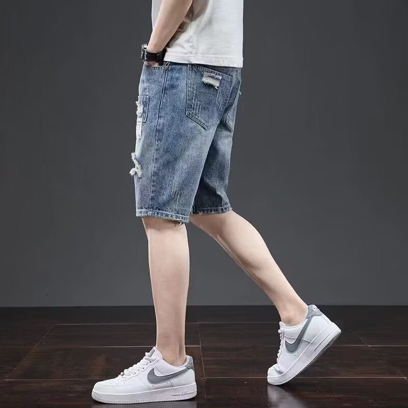 Light blue men's ripped denim shorts from Golden Heir with a five-point casual design and relaxed fit.
