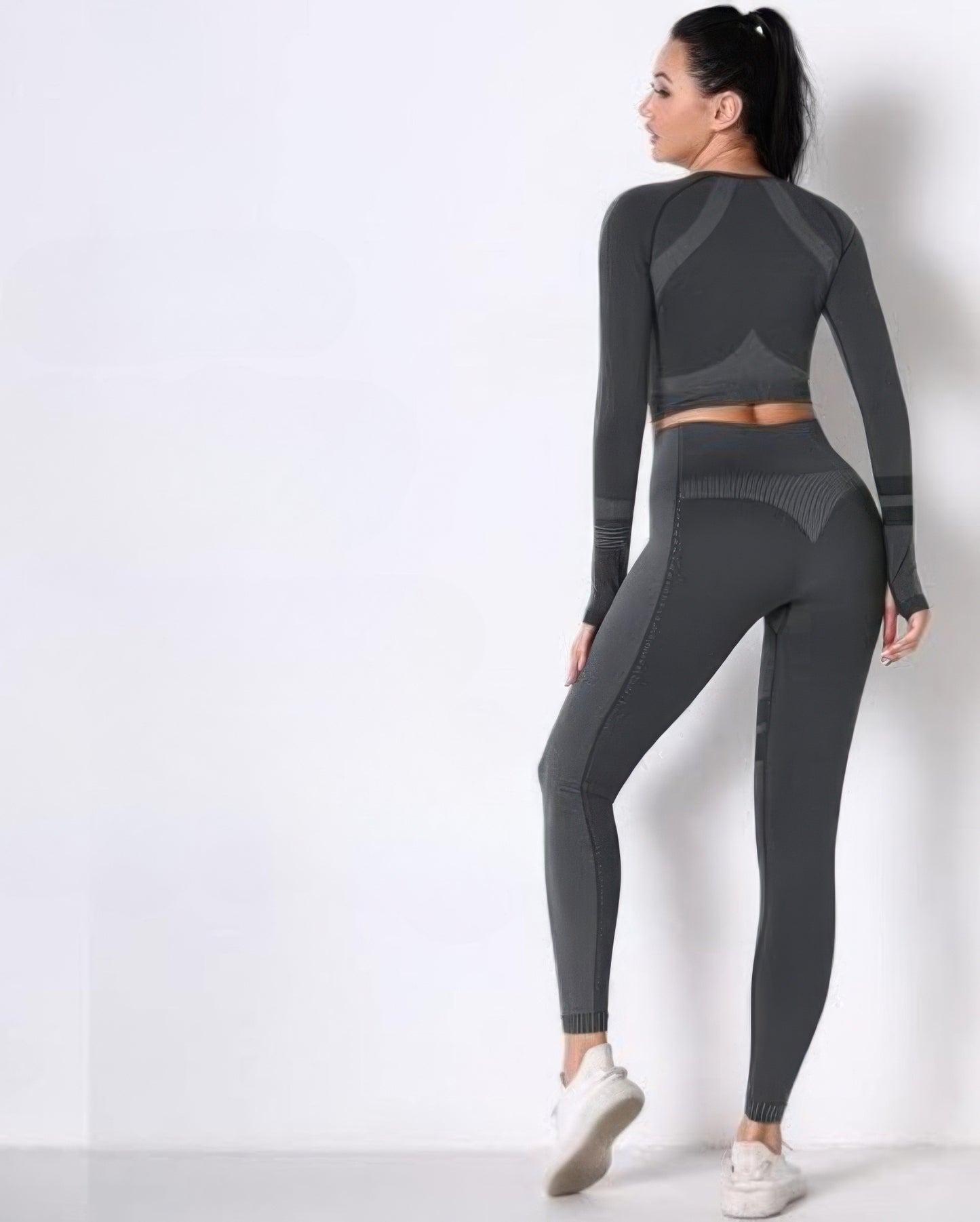 Golden Heir seamless long sleeve yoga set in dark gray, featuring a fitted activewear top and matching leggings for workout comfort.