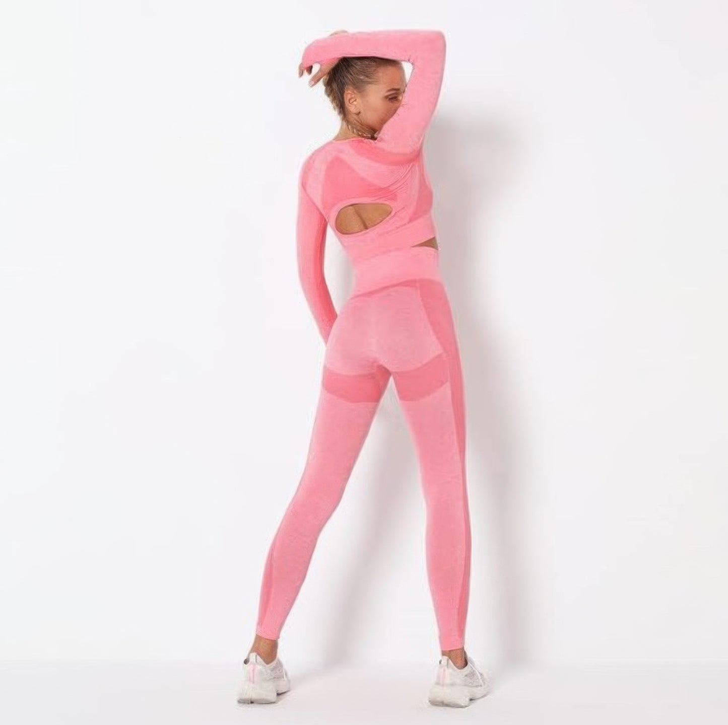 Pink Golden Heir seamless long sleeve yoga set for activewear, shown flat with fitted design and soft, stretchy fabric.