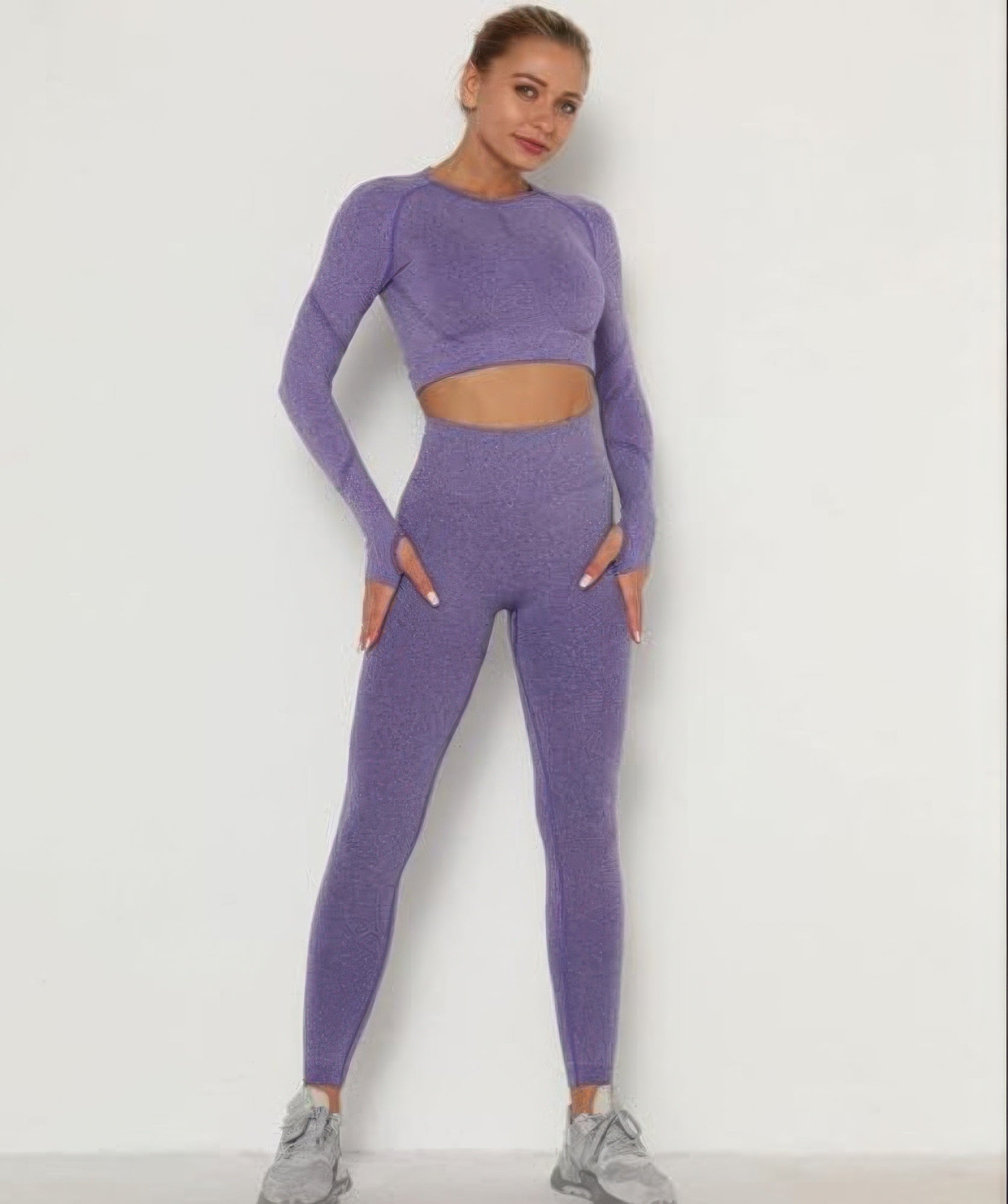 Golden Heir purple seamless activewear set featuring a fitted top and high-waisted leggings for comfortable workouts.