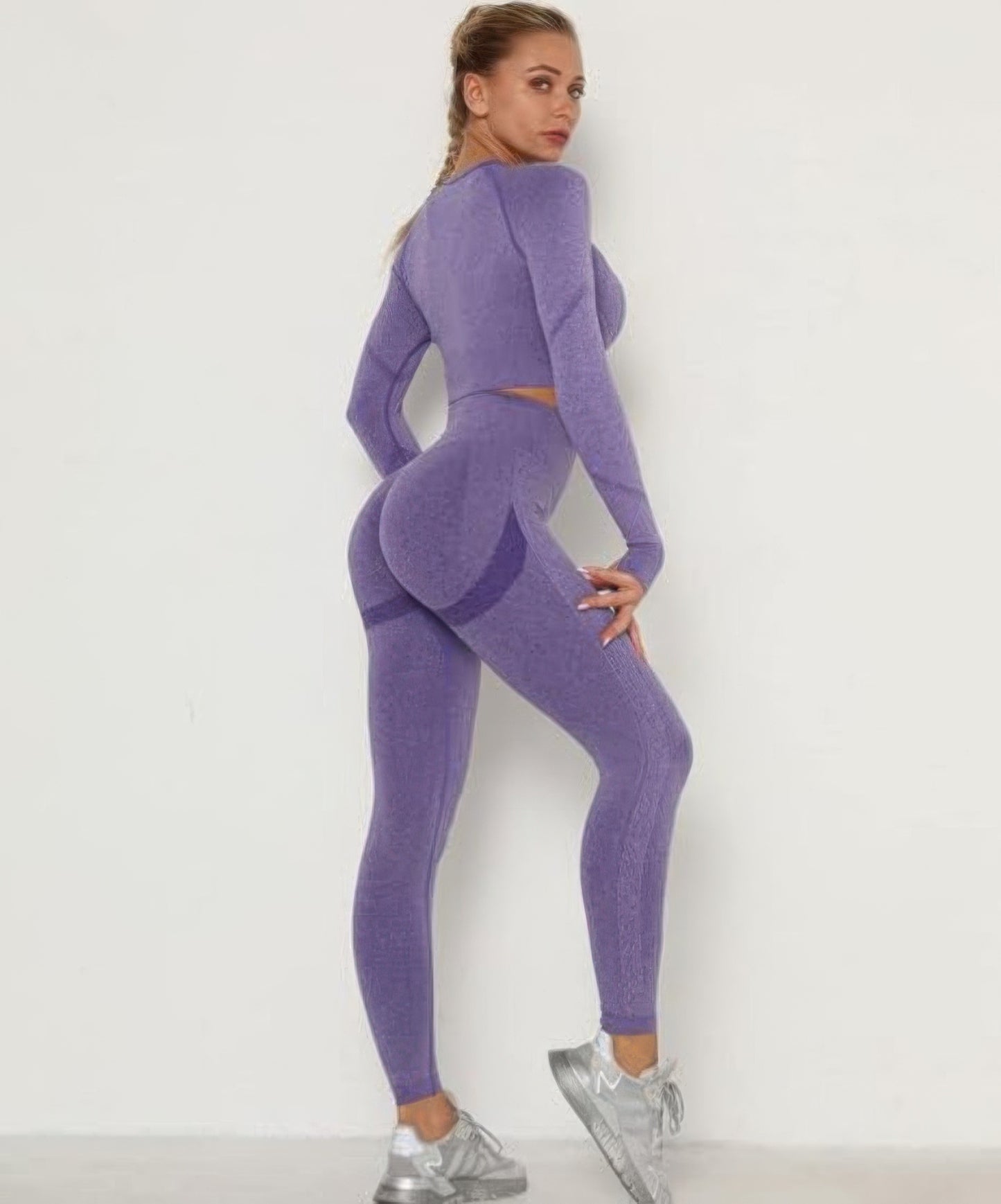Golden Heir purple seamless activewear set featuring a fitted top and matching leggings, ideal for workout or casual wear.