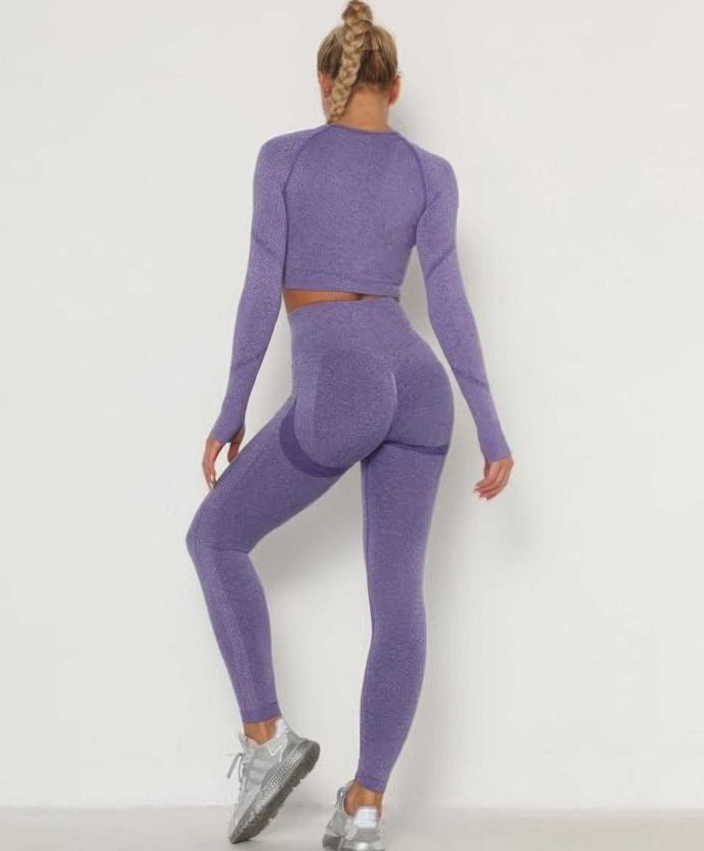 Golden Heir purple seamless activewear set featuring a fitted top and matching leggings for workout or casual wear.