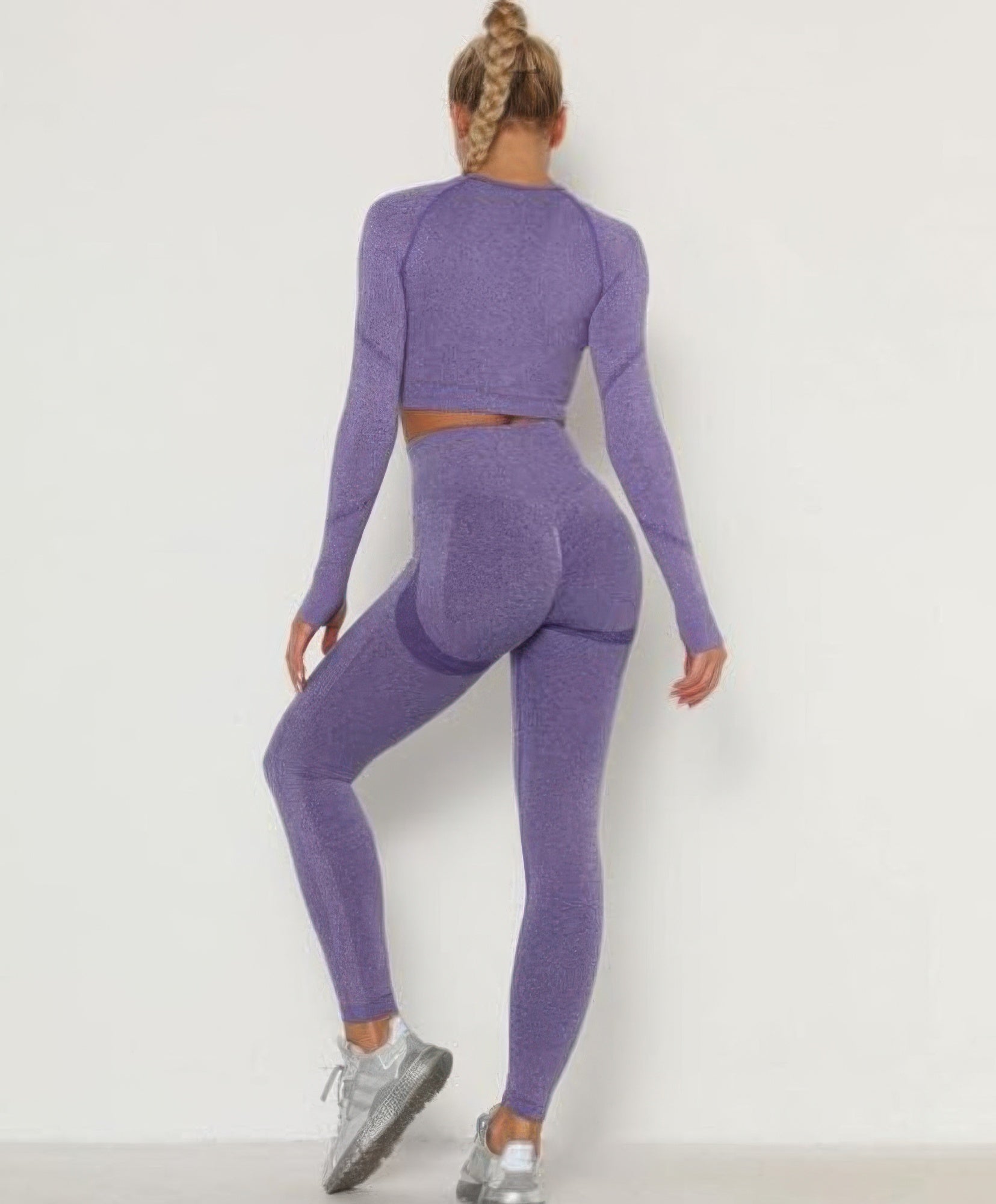 Golden Heir purple seamless activewear set featuring a fitted top and matching leggings for workout or casual wear.