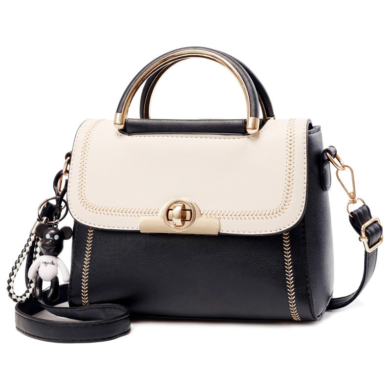 Black embroidered lace crossbody bag for women from Golden Heir, featuring intricate embroidery and a stylish design.