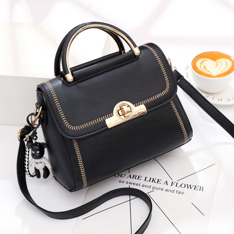 Black embroidered lace crossbody bag for women by Golden Heir, stylish and fashionable accessory with intricate lace details.