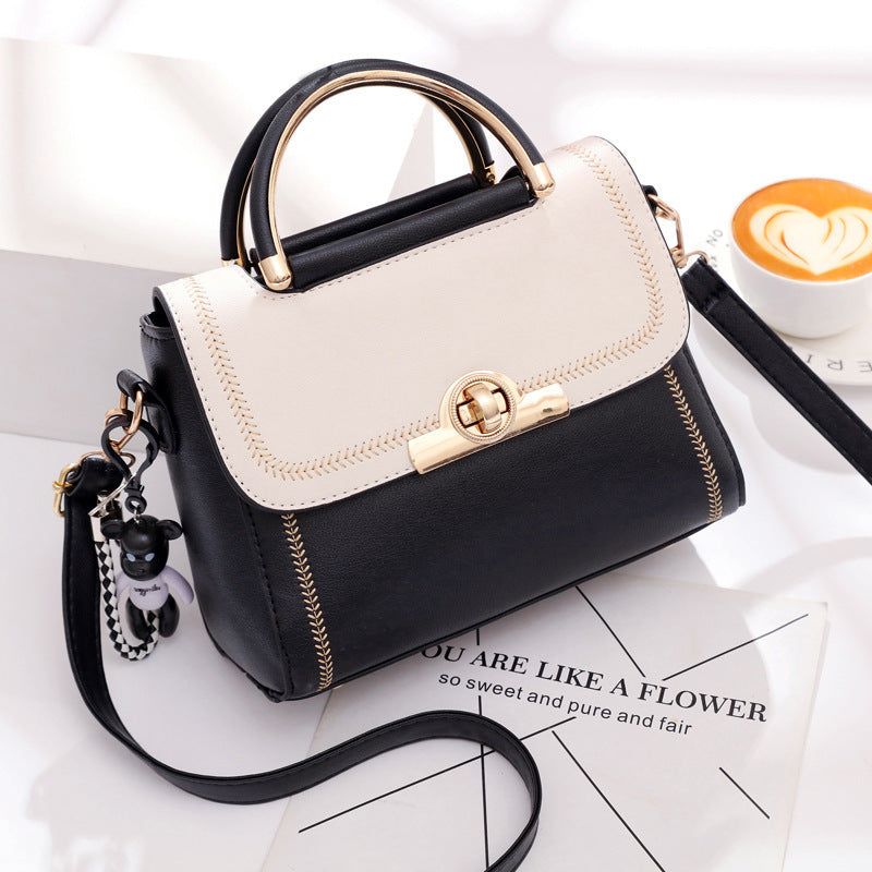 Black embroidered lace crossbody bag for women by Golden Heir, featuring intricate embroidery and a stylish, compact design.