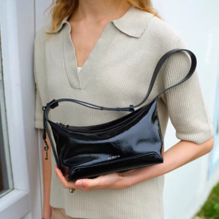 Black full-grain leather women's crossbody bag by Golden Heir, featuring a compact design and genuine leather construction.