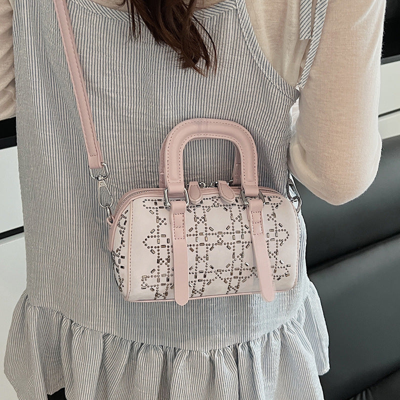 Black Korean-style minimalist cylindrical tote bag by Golden Heir with a pendant, versatile and chic for everyday use.