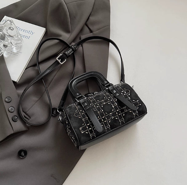 Black Korean-style minimalist tote bag by Golden Heir featuring a pendant and versatile cylindrical design.