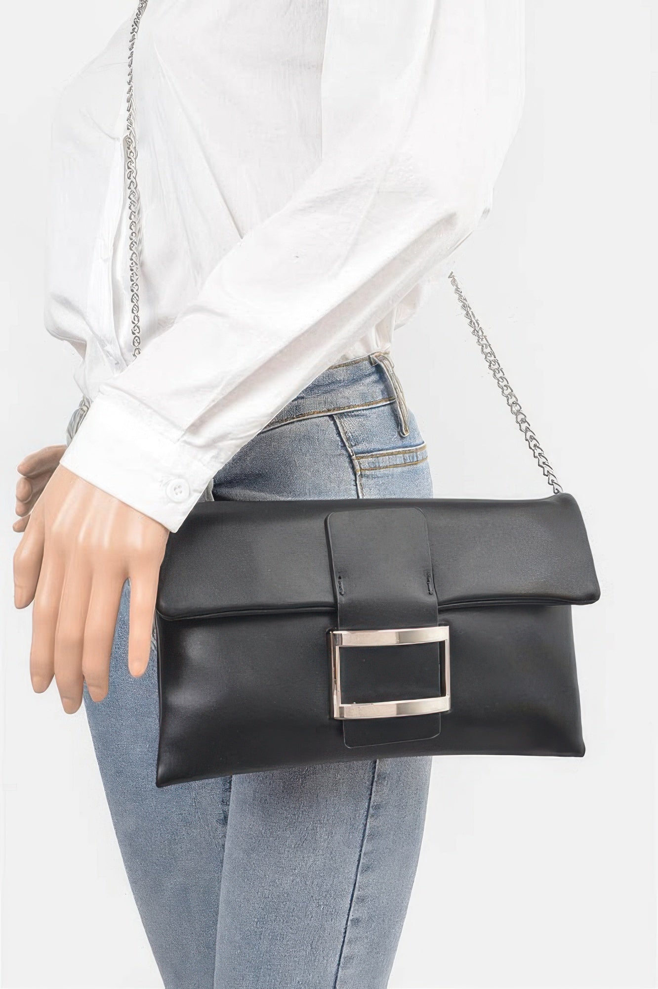 Golden Heir metallic faux leather clutch bag with buckle detail, black and gold finish, stylish and compact evening accessory.