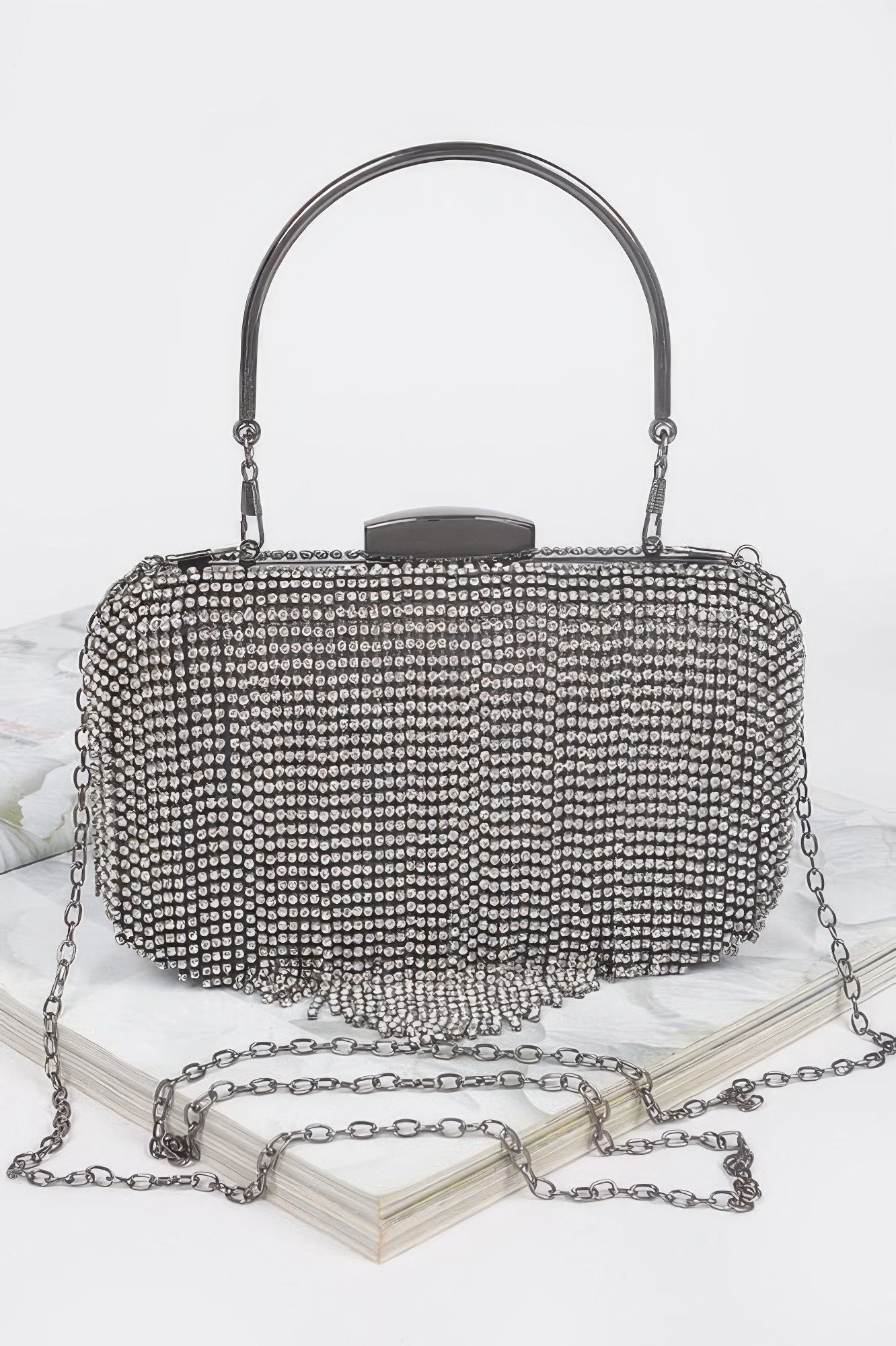 Golden Heir rhinestone fringe hard clutch bag with black finish, featuring shimmering rhinestones and a stylish, compact design.