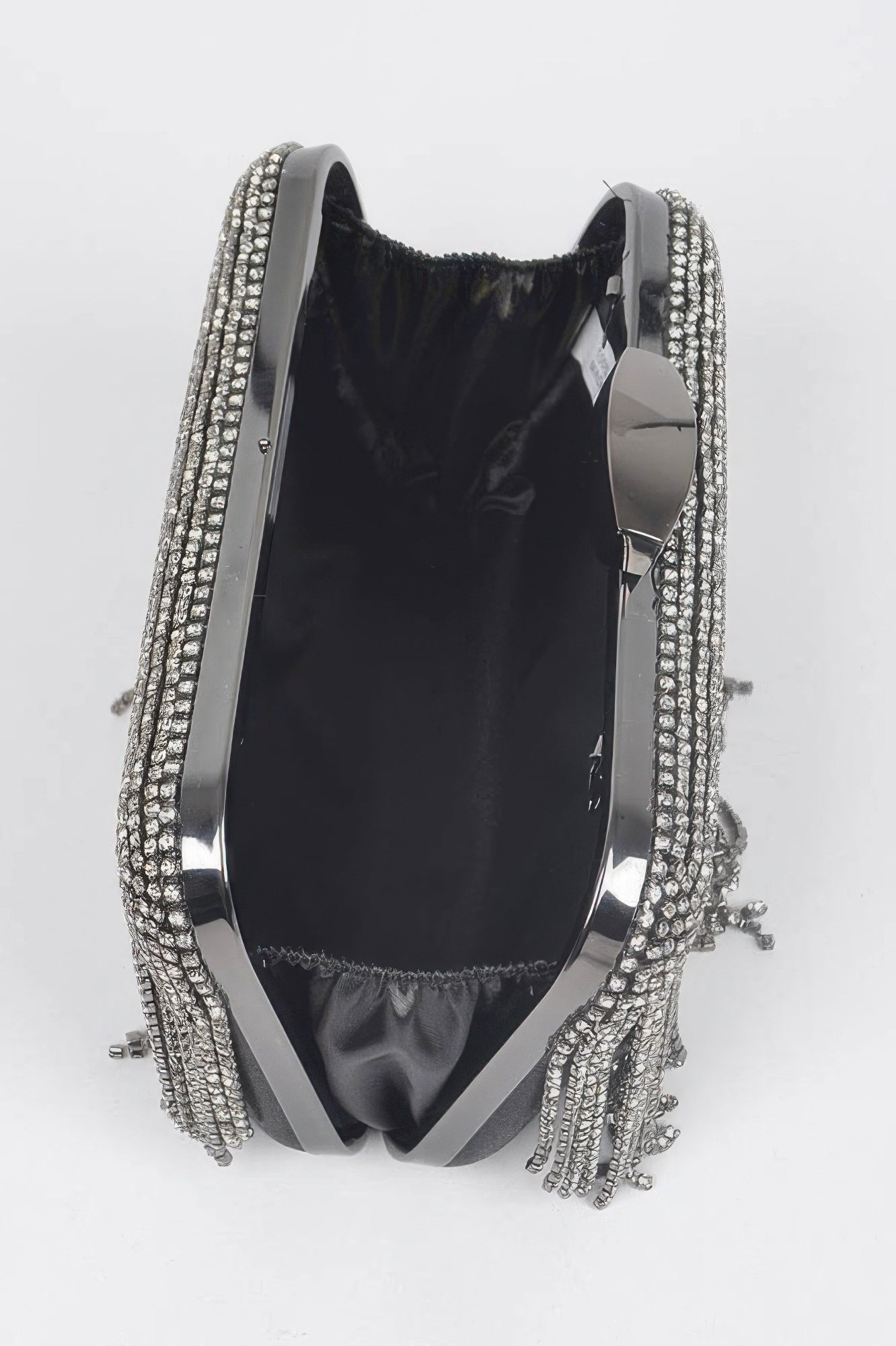 Golden Heir rhinestone fringe hard clutch bag with black and gold accents, featuring sparkling rhinestones and a sleek, structured design.