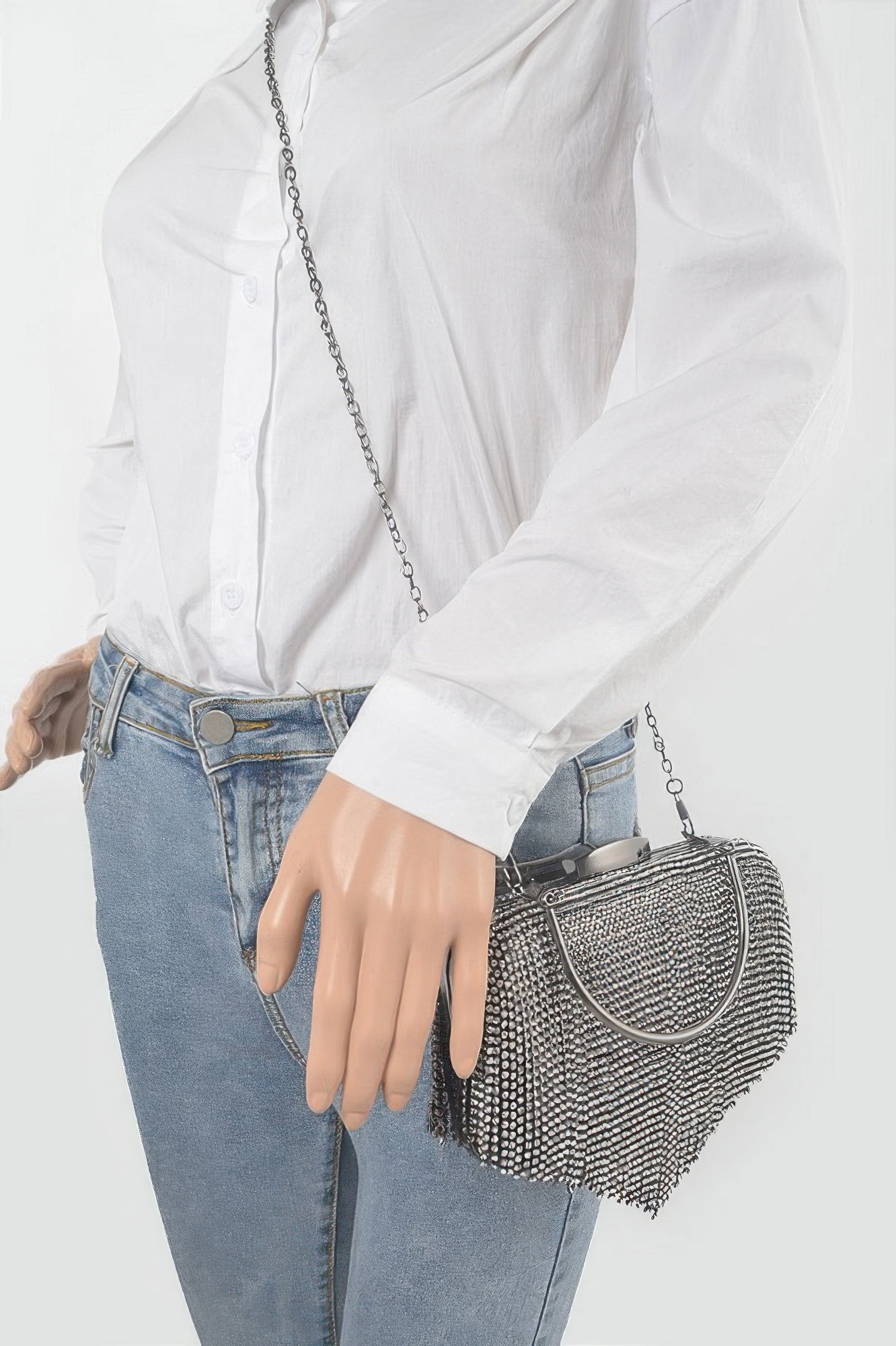 Golden Heir rhinestone fringe hard clutch bag with black background and sparkling embellishments for elegant occasions.