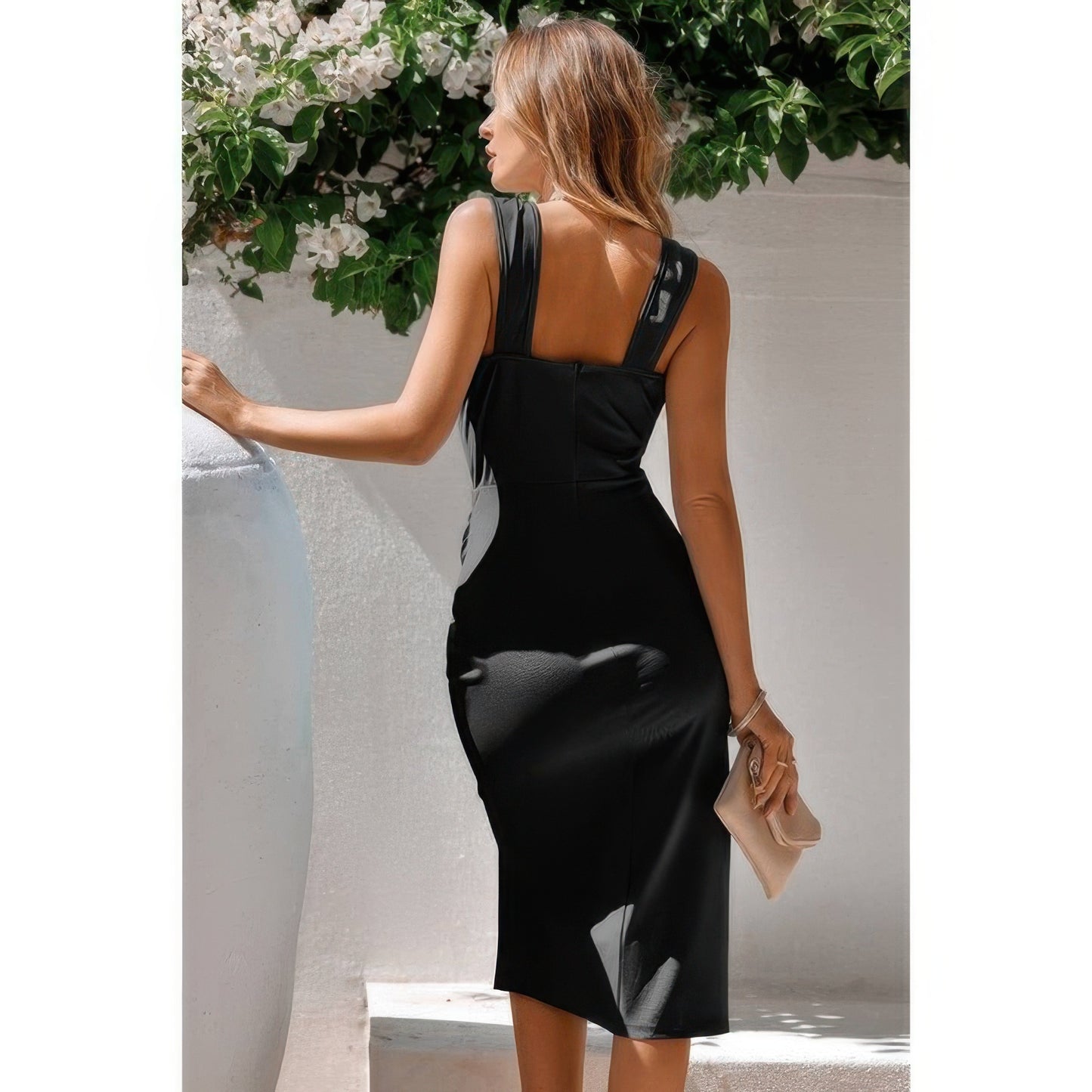 Golden Heir black sleeveless cross bodycon dress for women, form-fitting and stylish, shown on a model.