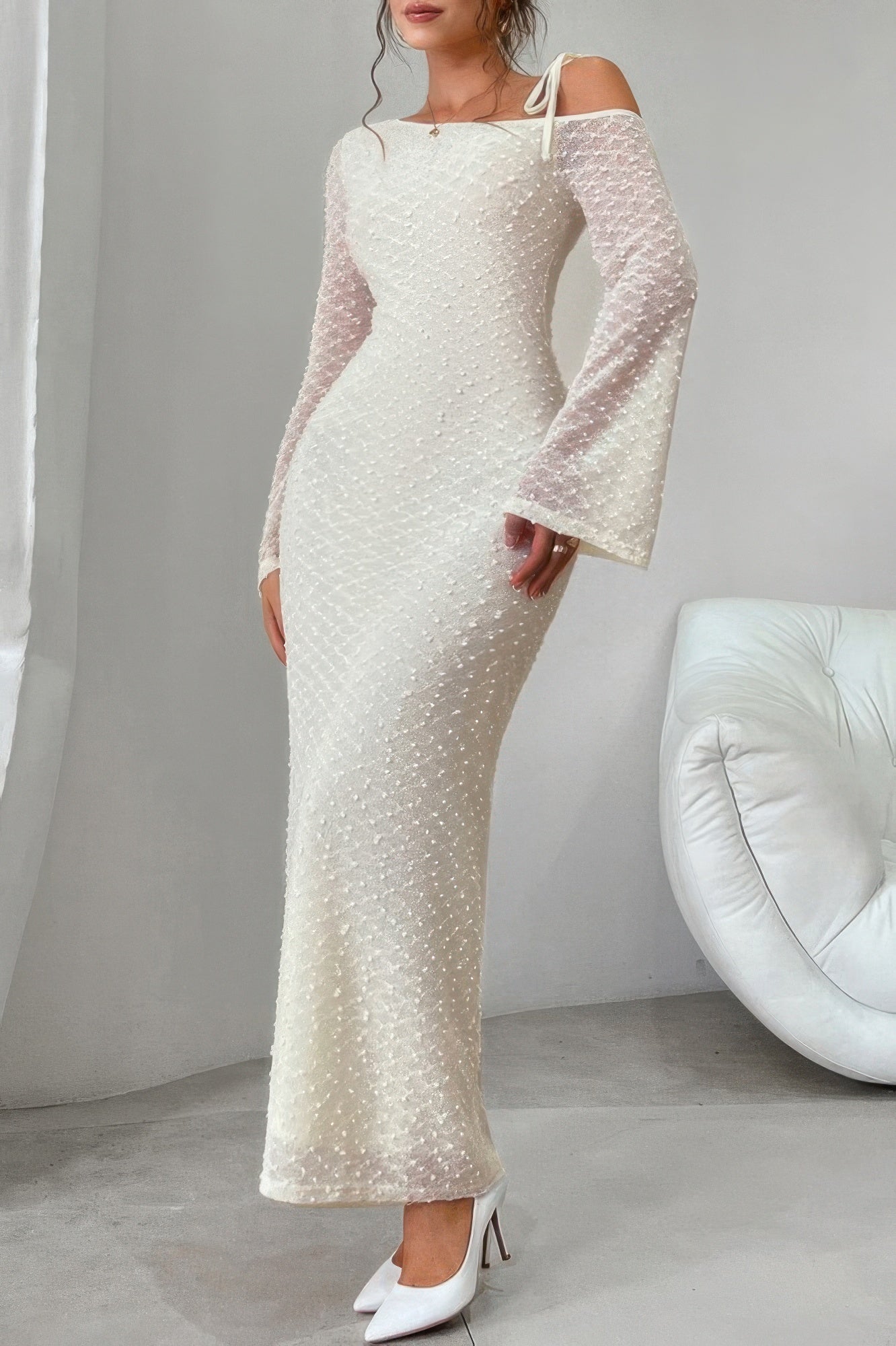 Golden Heir beige off-shoulder sculpt bodycon midi dress displayed on a model, highlighting its fitted silhouette and elegant design.