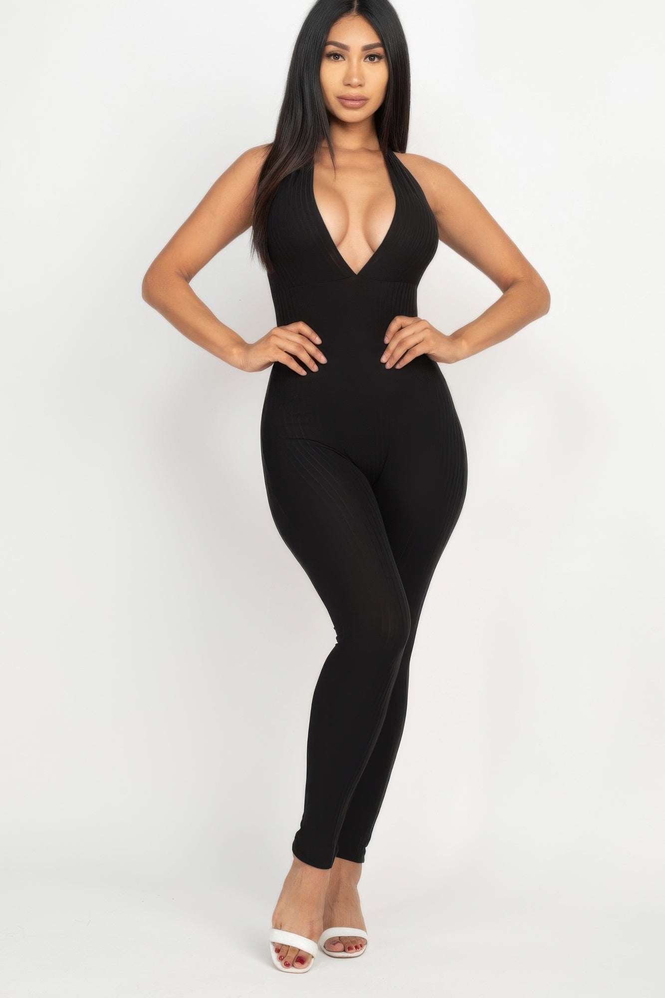 Golden Heir halter V-neck ribbed bodycon jumpsuit in berry color, form-fitting design, styled for a chic look.