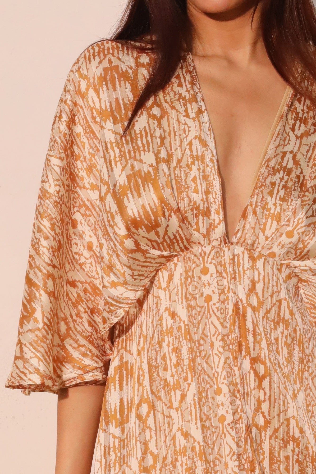 Golden Heir bohemian lurex chiffon cape maxi dress featuring flowing fabric and golden shimmer, perfect for elegant occasions.