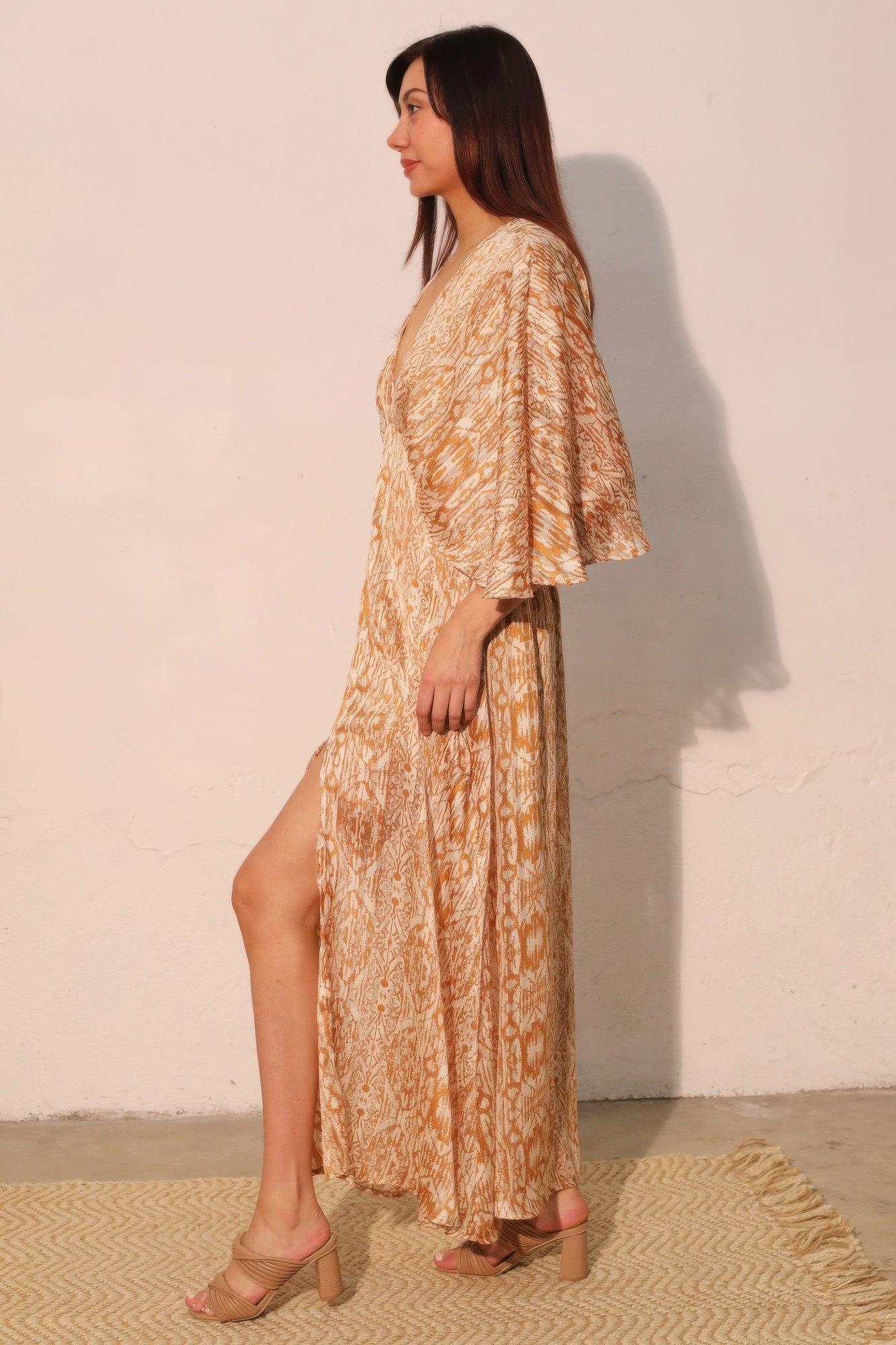 Golden Heir bohemian lurex chiffon cape maxi dress with flowing silhouette and intricate details, perfect for elegant occasions.