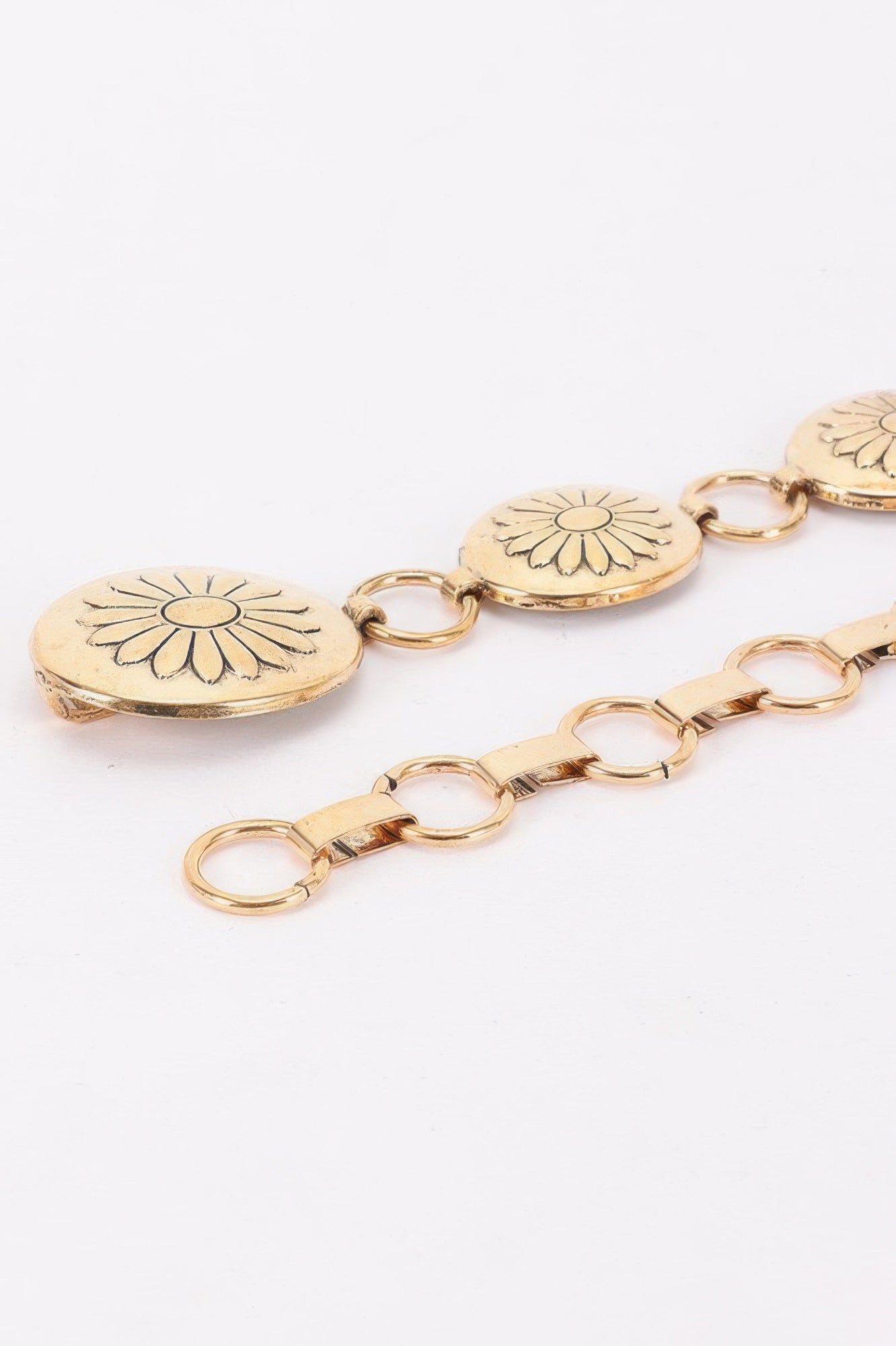 Golden Heir floral disc chain belt in gold with a stylish design, suitable for all sizes, featuring intricate floral details.