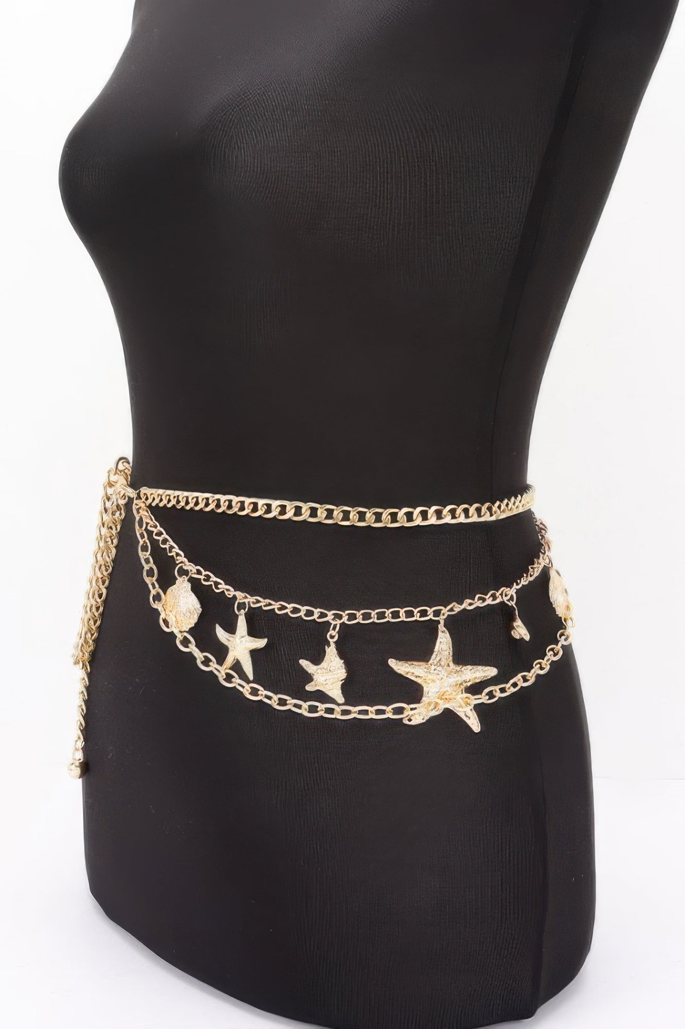 Golden Heir seashell starfish layered chain belt in gold with intricate shell and starfish details, stylish accessory for casual or beach wear.