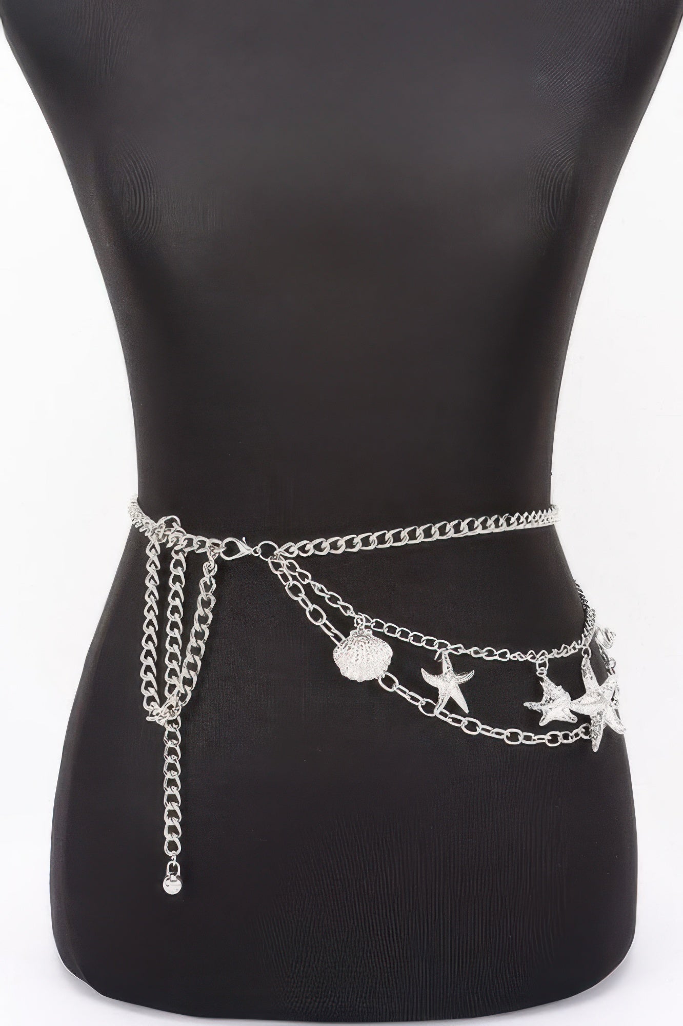 Golden Heir seashell starfish layered chain belt in shiny gold with adjustable length and detailed shell and starfish charms.