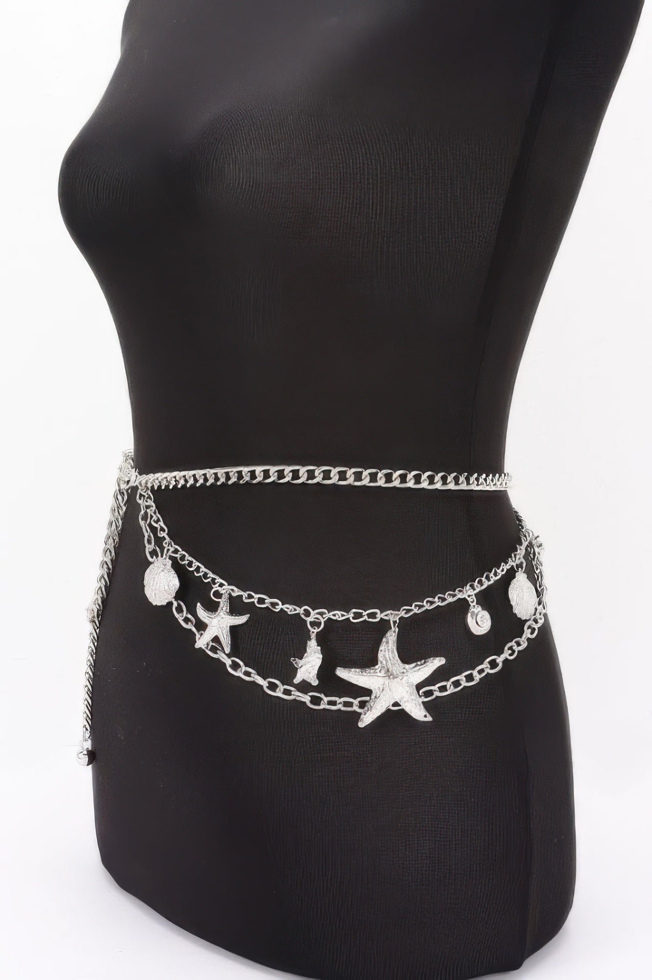 Golden Heir seashell starfish layered chain belt in gold with intricate shell and starfish details, versatile for summer outfits.