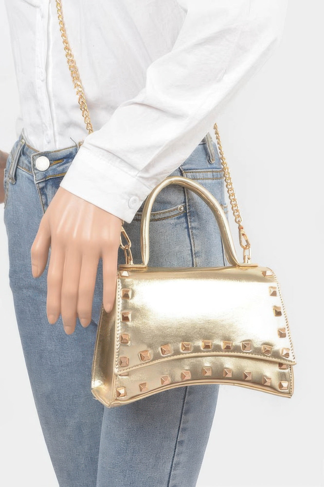 Golden Heir metallic faux leather clutch bag with studded top handle, stylish and compact for evening or special occasions.