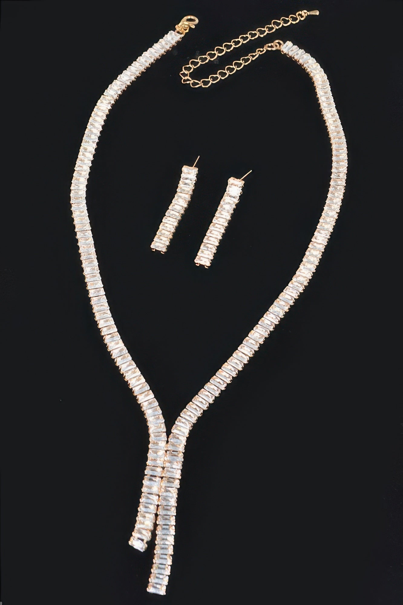 Golden Heir Lumière Duo rhinestone necklace and earring set with clear and gold stones, elegant coordinated jewelry for special occasions.