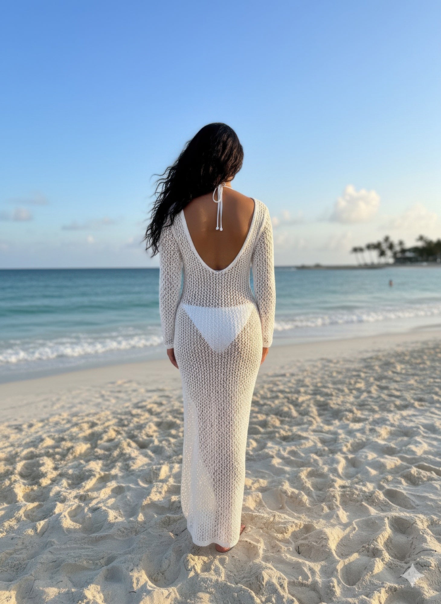 White Golden Heir long sleeve crochet maxi dress, flowing design with intricate crochet pattern, stylish and elegant for warm weather.