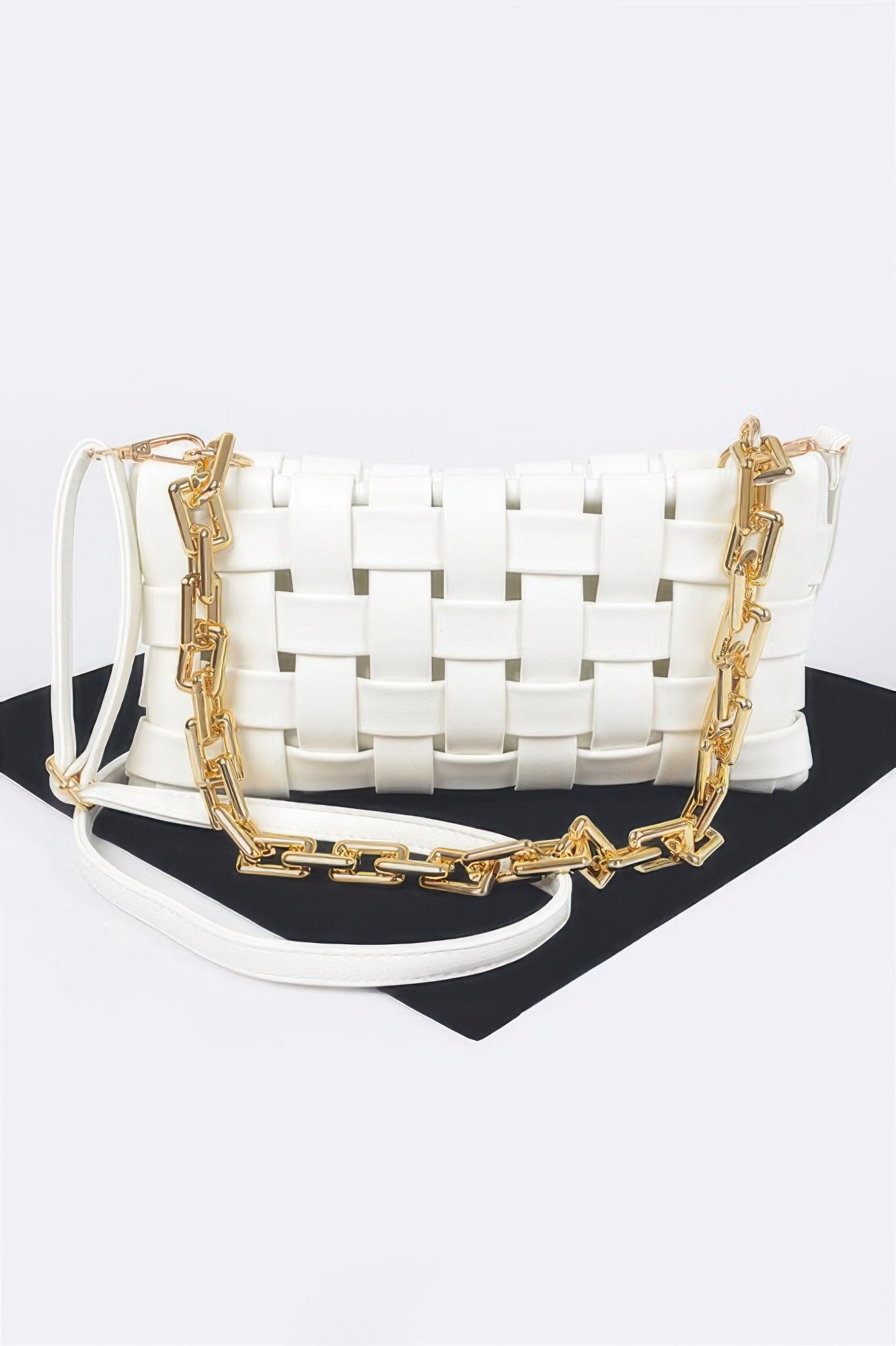 Golden Heir braided chain crossbody bag in black with gold accents, featuring a sleek design and adjustable strap.