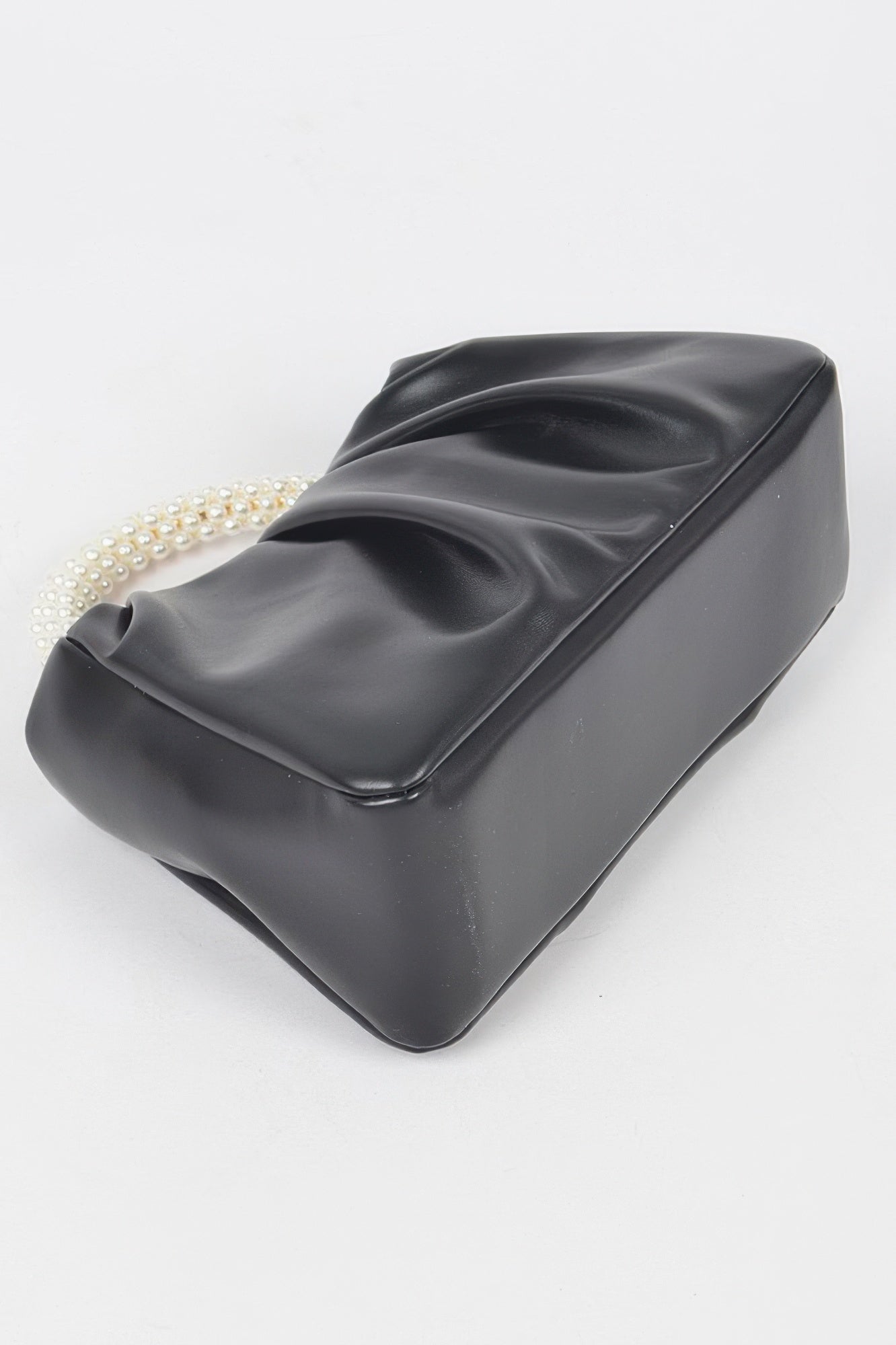 Golden Heir faux leather crossbody bag with pearl handle in black, featuring a sleek design and gold accents.