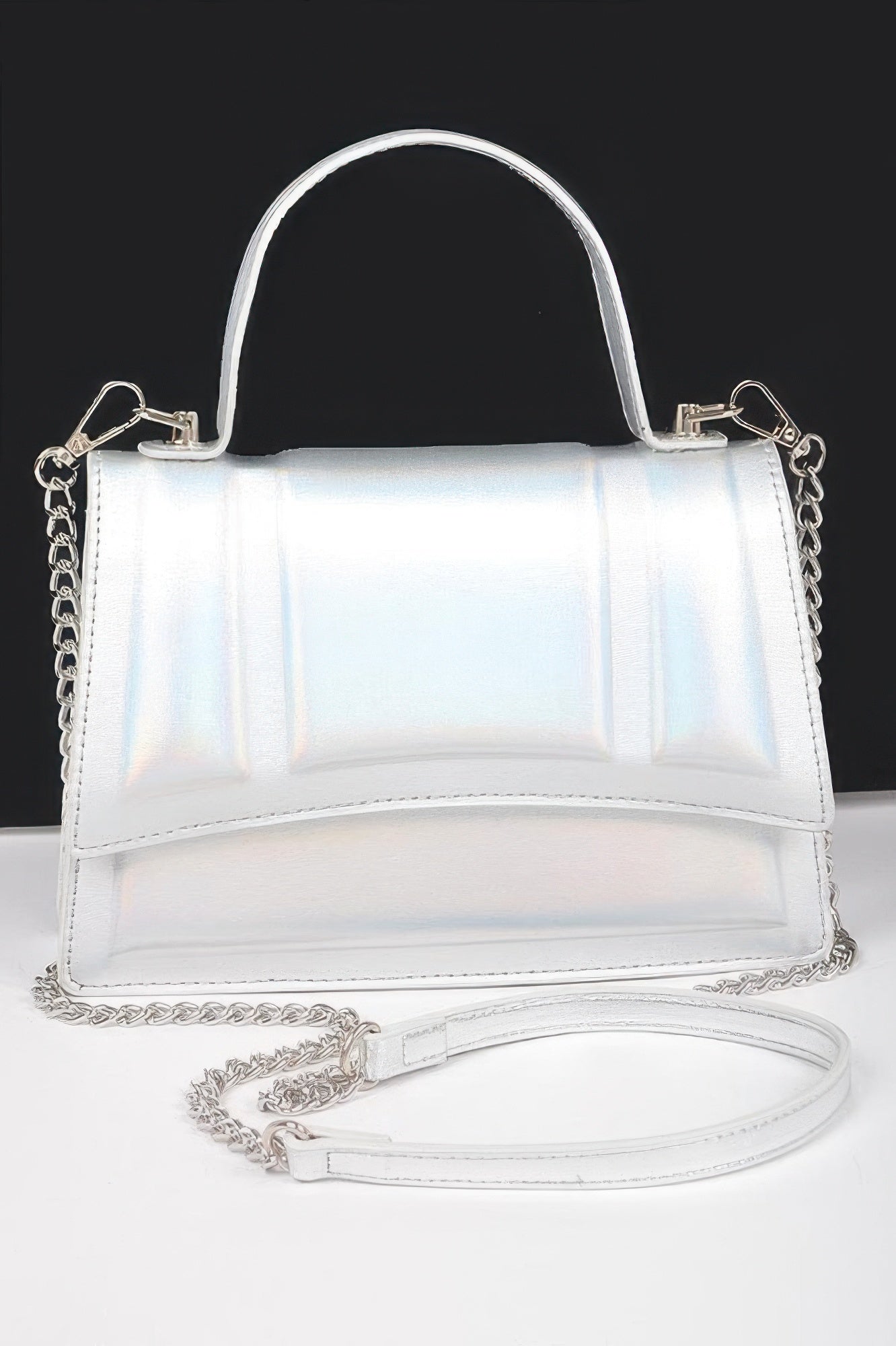 Golden Heir metallic crossbody bag with top handle, gold finish, stylish and compact for everyday or evening use.
