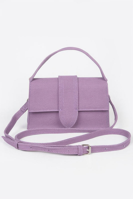 Lavender denim crossbody bag by Golden Heir with top handle and adjustable strap, stylish and functional accessory.