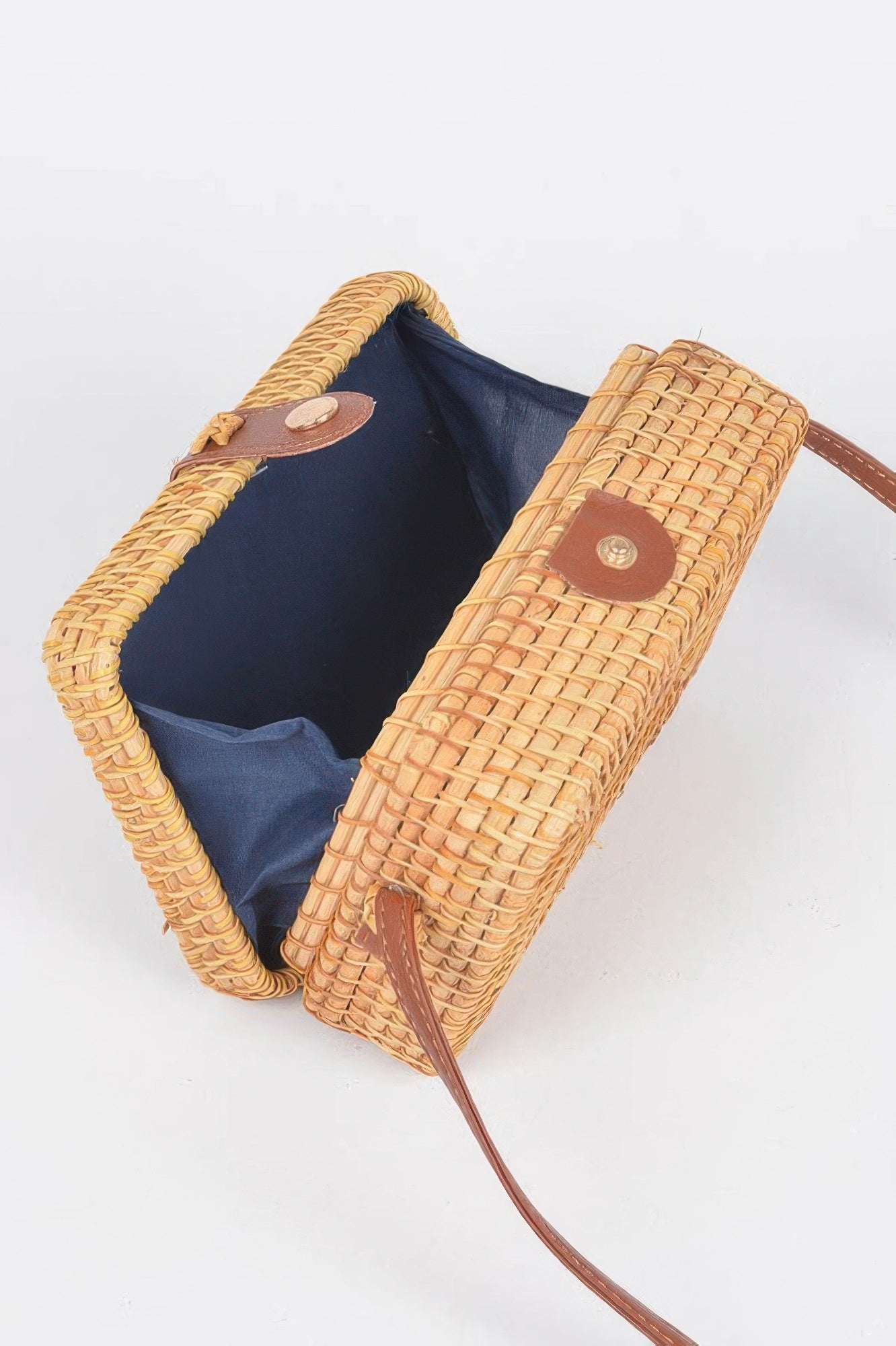 Golden Heir crossbody bamboo box bag with natural finish, featuring a compact design and wooden handle for stylish carrying.