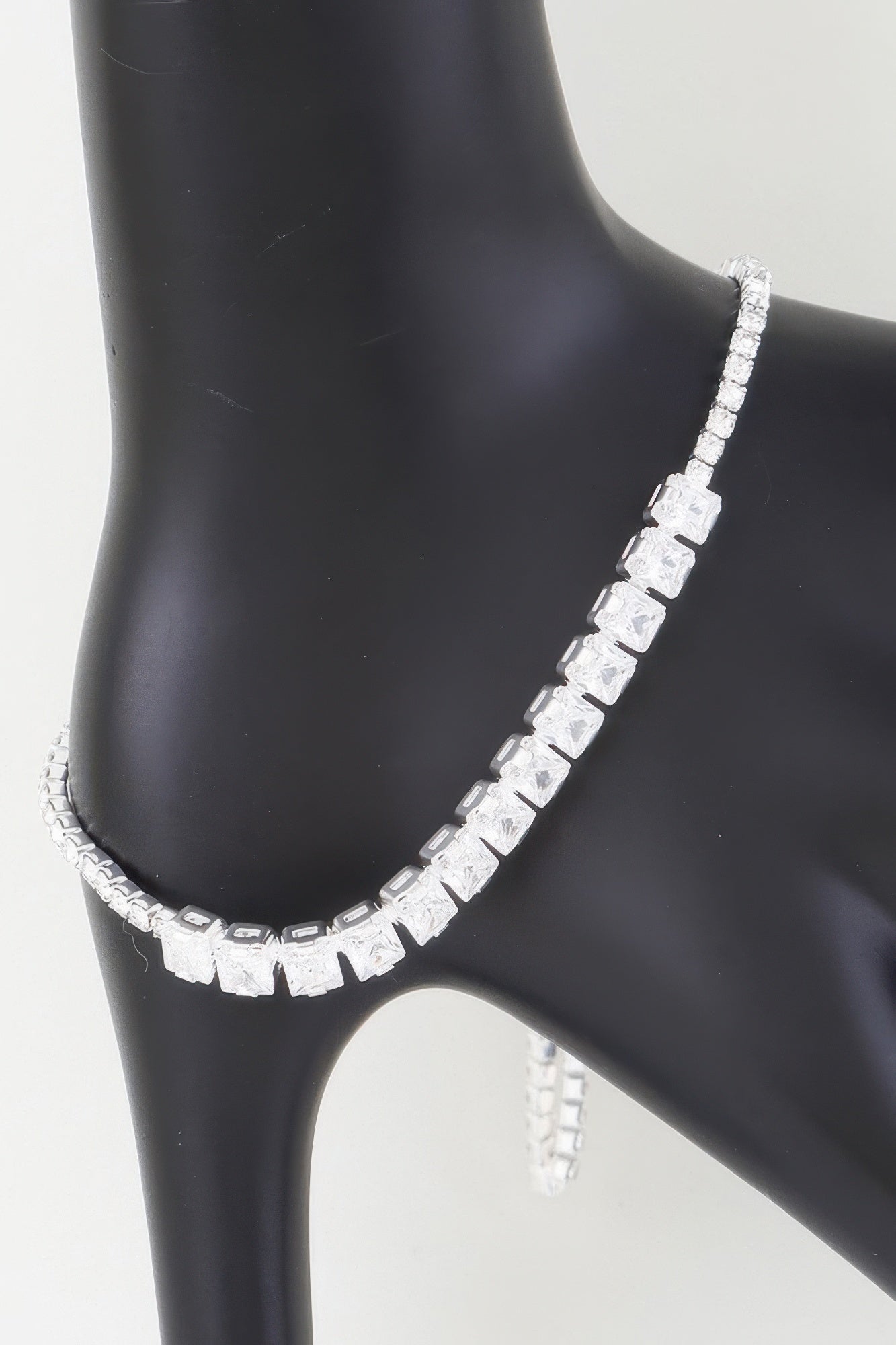 Golden Heir multi-cubic jeweled bracelet featuring silver and gold-tone cubic embellishments with sparkling gemstones.