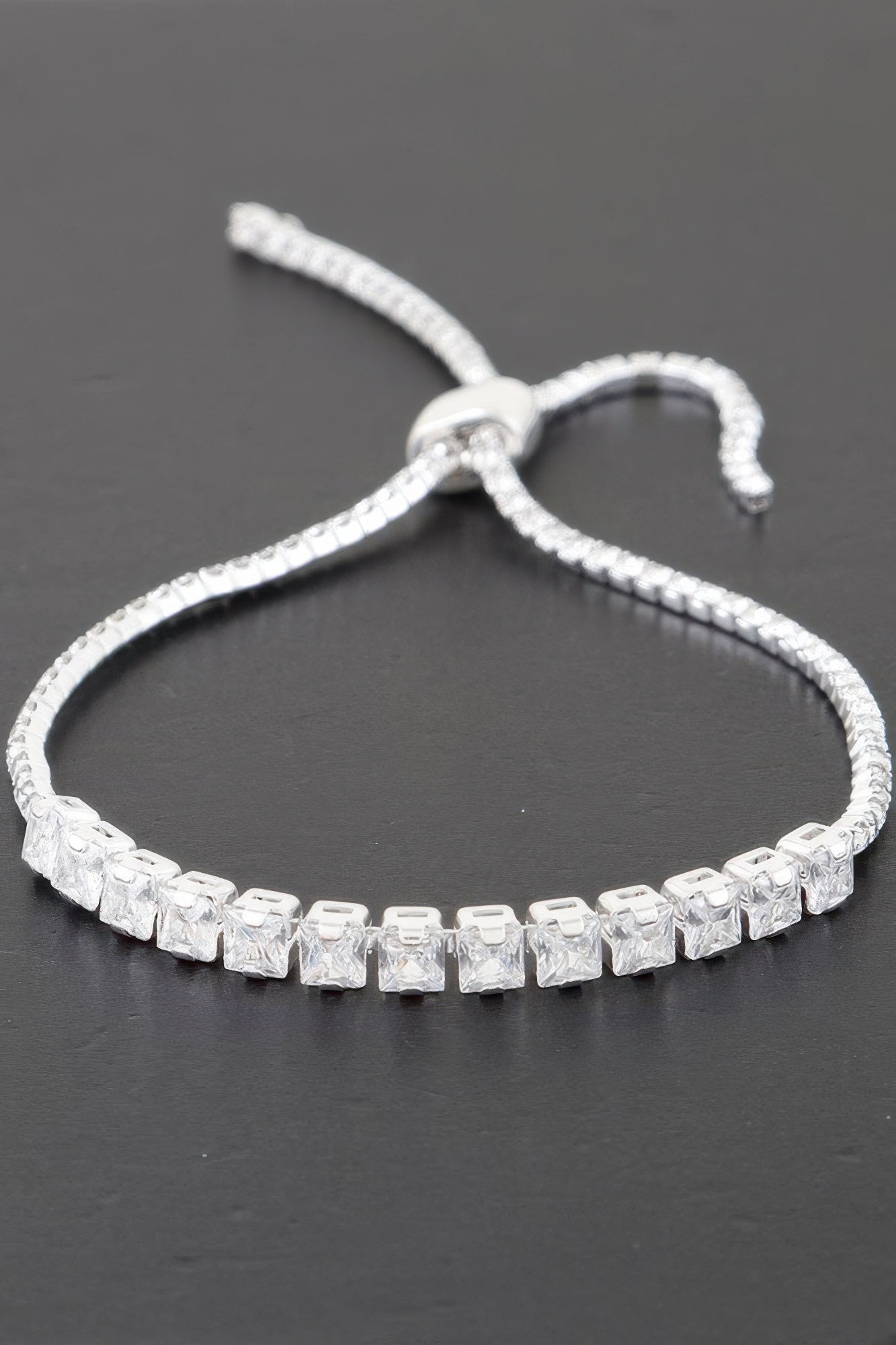 Golden Heir multi cubic jeweled bracelet featuring silver and gold tones with sparkling cubic stones.