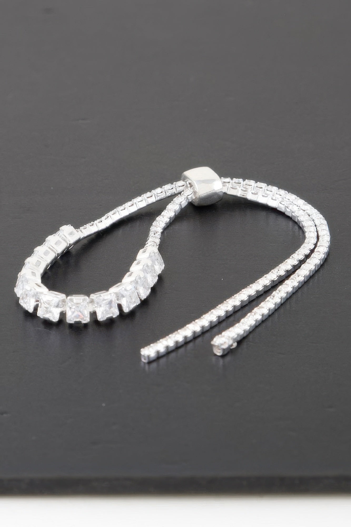 Golden Heir multi cubic jeweled bracelet featuring silver and gold-toned cubic stones and intricate design details.
