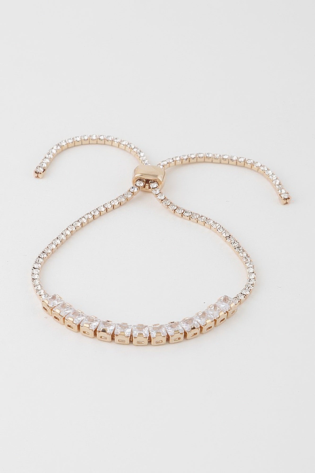 Golden Heir multi-cubic jeweled bracelet with silver and gold tones featuring sparkling cubic stones on a delicate chain.