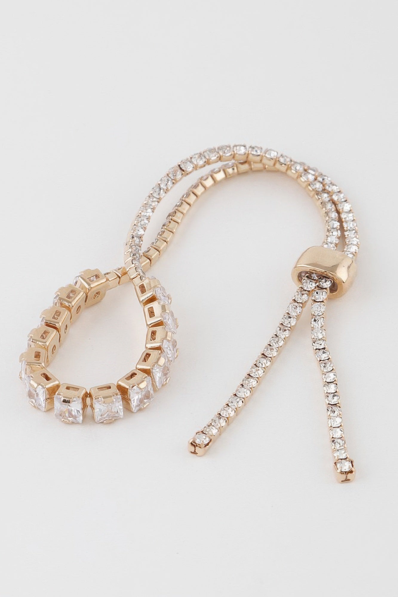 Golden Heir multi-cubic jeweled bracelet featuring silver and gold tones with sparkling cubic stones.