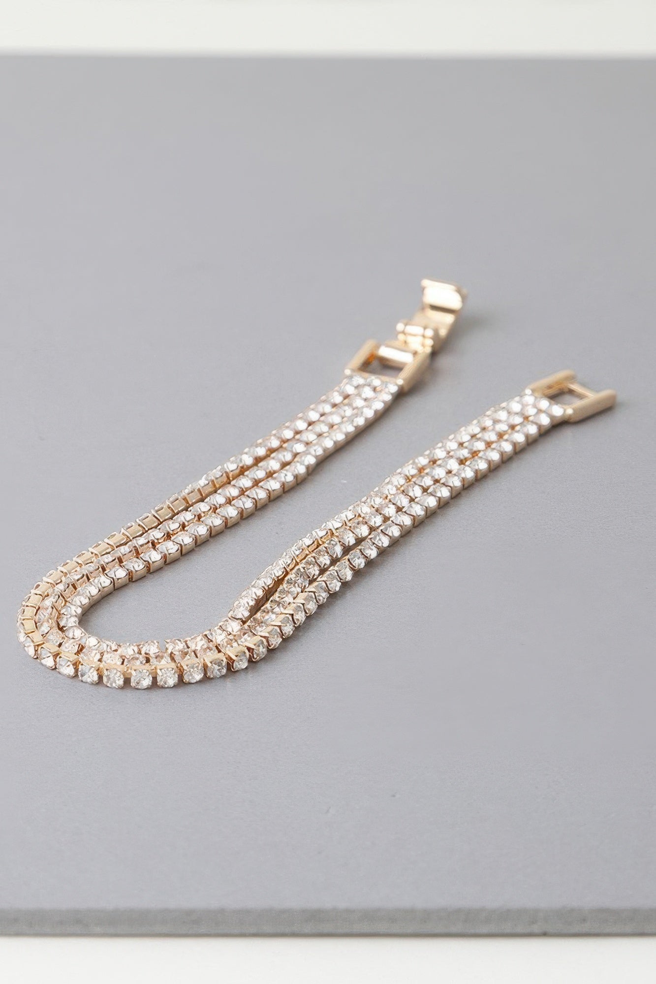 Golden Heir triple cubic jewel bracelet with silver and golden cubic stones, featuring a sleek, elegant design.