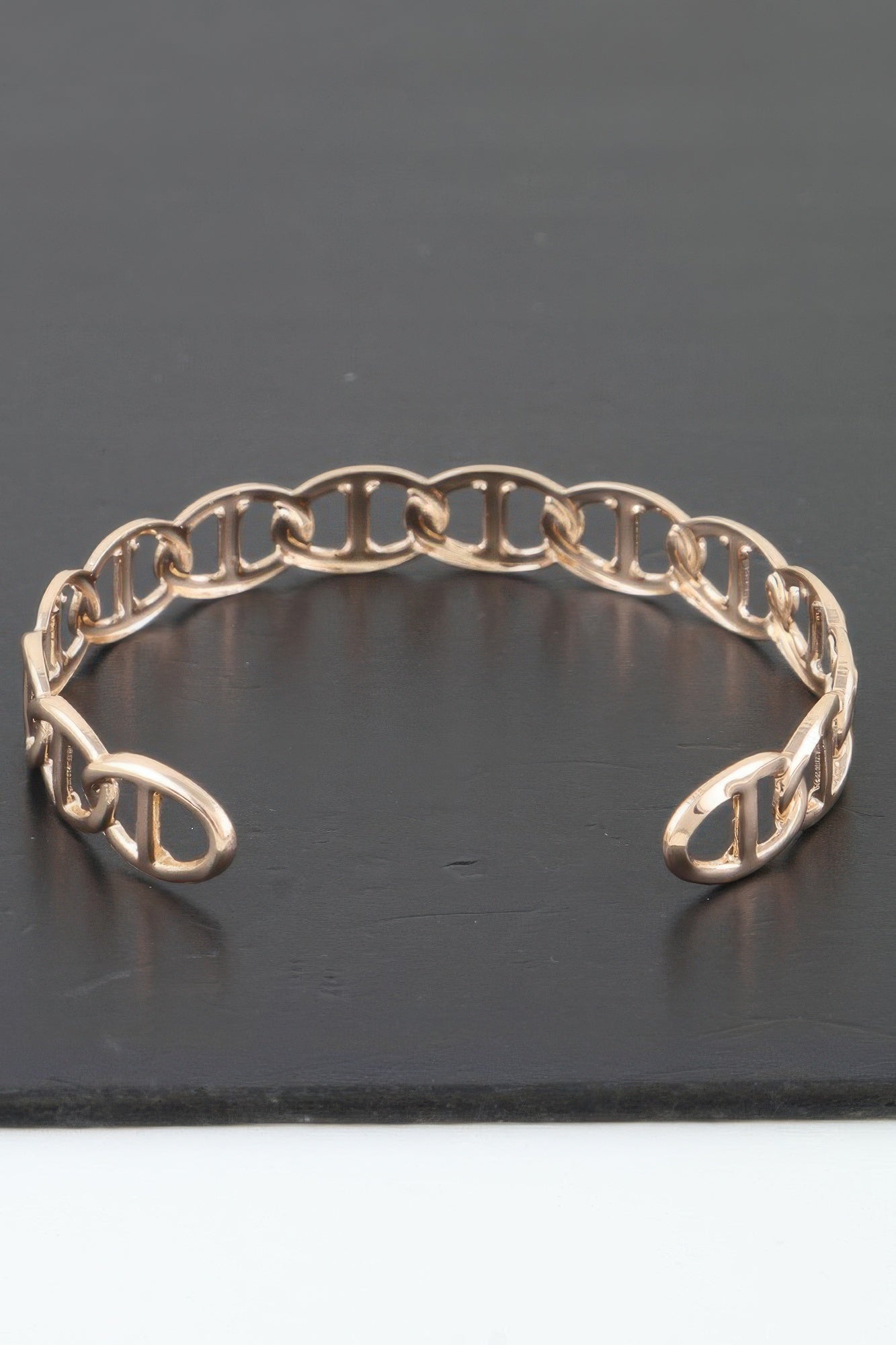 Golden Heir Mariner Chain Cuff Bracelet in gold, featuring a sleek, modern design with a textured chain link detail.